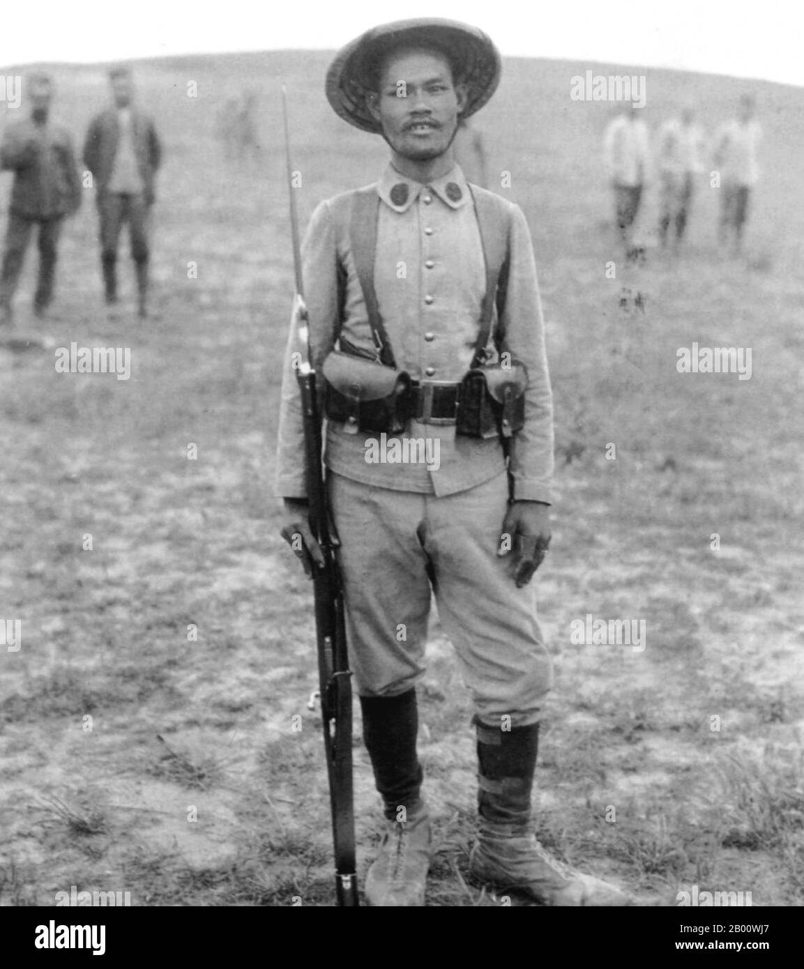 Vietnam: An Annamese 'tirailleur' or Vietnamese colonial soldier waiting to go into battle at Ypres, Belgium, in 1916.  Ypres occupied a strategic position during World War I because it stood in the path of Germany's planned sweep across the rest of Belgium and into France. In the Second Battle of Ypres (22 April to 25 May 1915), the Germans used poison gas for the first time on the Western Front (they had used it earlier at the Battle of Bolimov on 3 January 1915) and captured high ground east of the town. The first gas attack occurred against Canadian, British, and French soldiers. Stock Photo