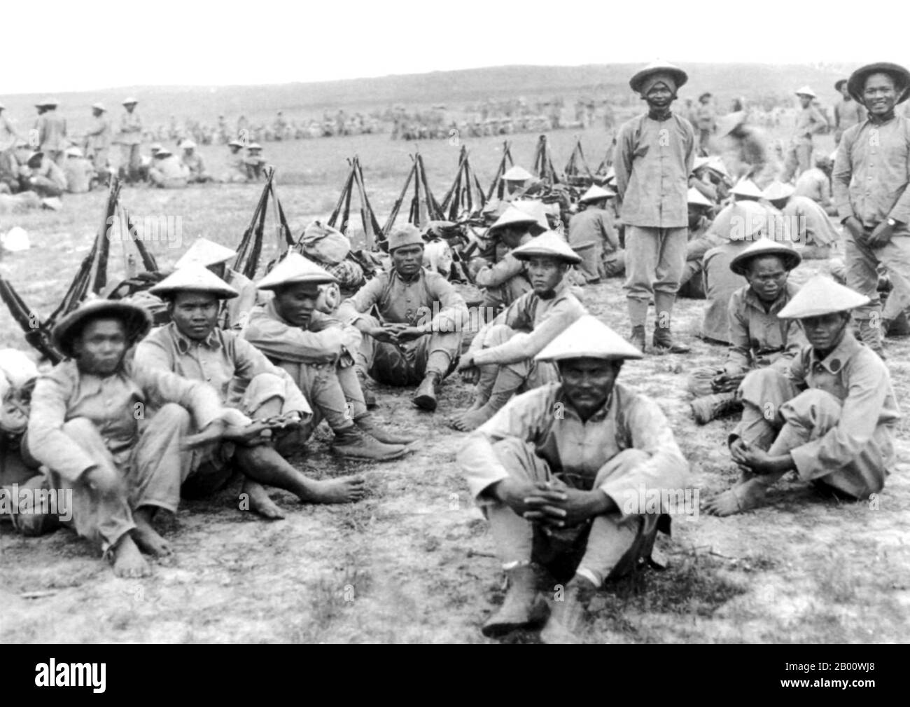 Vietnam: Annamese 'tirailleurs' or Vietnamese colonial soldiers waiting to go into battle at Ypres, Belgium, in 1916.  Ypres occupied a strategic position during World War I because it stood in the path of Germany's planned sweep across the rest of Belgium and into France. In the Second Battle of Ypres (22 April to 25 May 1915), the Germans used poison gas for the first time on the Western Front (they had used it earlier at the Battle of Bolimov on 3 January 1915) and captured high ground east of the town. The first gas attack occurred against Canadian, British, and French soldiers. Stock Photo