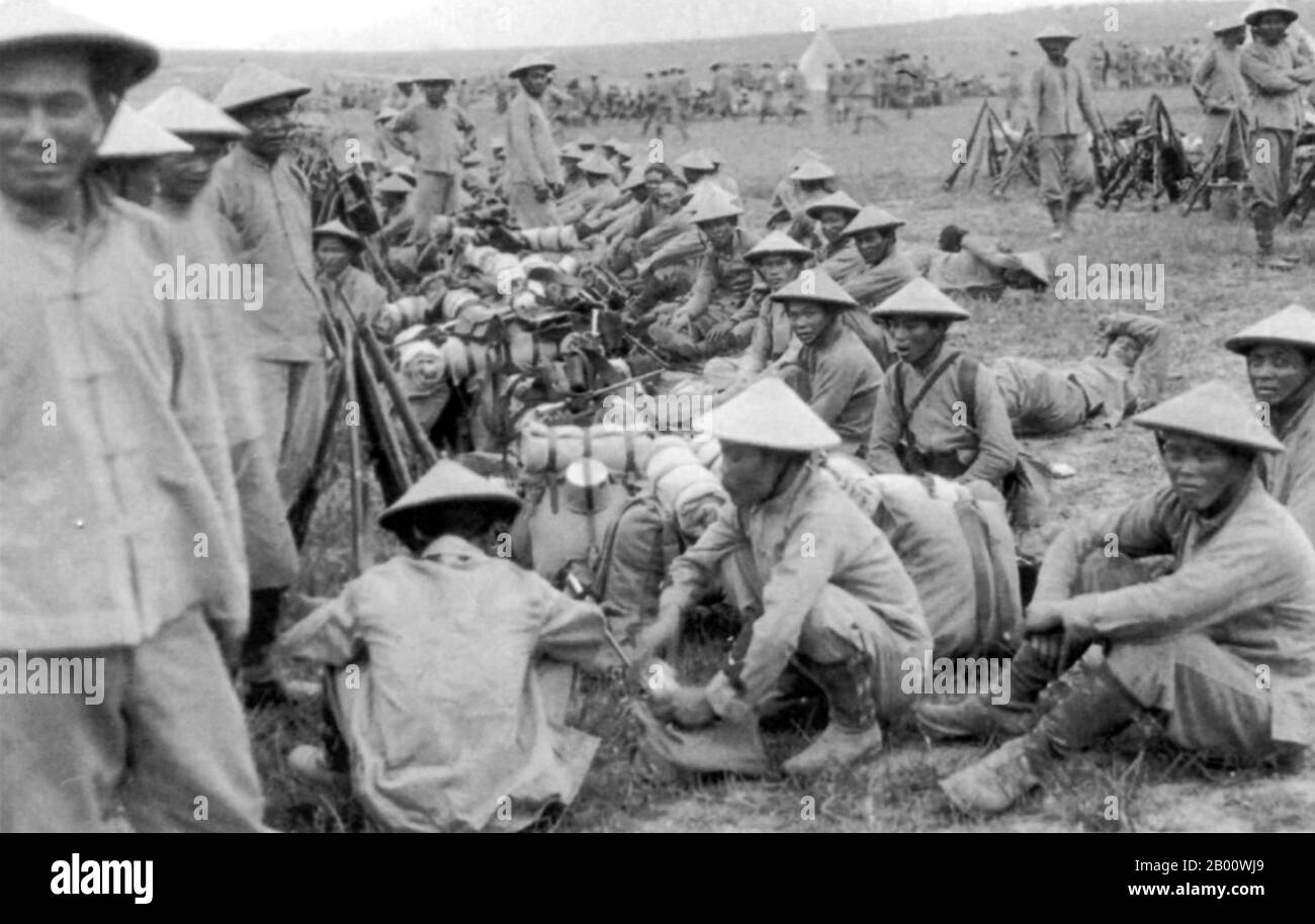 Vietnam: Annamese 'tirailleurs' or Vietnamese colonial soldiers waiting to go into battle at Ypres, Belgium, in 1916.  Ypres occupied a strategic position during World War I because it stood in the path of Germany's planned sweep across the rest of Belgium and into France. In the Second Battle of Ypres (22 April to 25 May 1915), the Germans used poison gas for the first time on the Western Front (they had used it earlier at the Battle of Bolimov on 3 January 1915) and captured high ground east of the town. The first gas attack occurred against Canadian, British, and French soldiers. Stock Photo