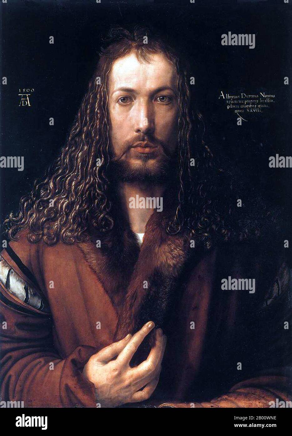 Germany: 'Self-Portrait in a Fur-Collared Robe'. Oil on lime panel painting by Albrecht Dürer (1471-1528), 1500.  Albrecht Dürer (21 May 1471 – 6 April 1528) was a German painter, printmaker and theorist from Nuremberg. His prints established his reputation across Europe when he was still in his twenties, and he has been conventionally regarded as the greatest artist of the Northern Renaissance ever since. Dürer's introduction of classical motifs into Northern art, through his knowledge of Italian artists and German humanists, helped secure his important reputation in the Northern Renaissance. Stock Photo