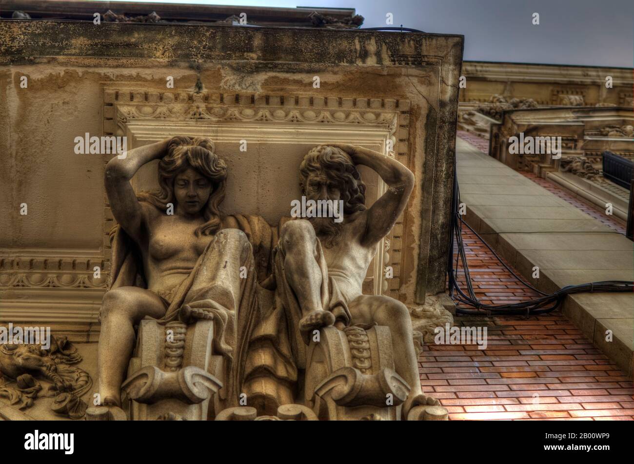 Atlas and Caryatid supporting a balcony in Seville, Andalusia, Spain. Detail. Stock Photo