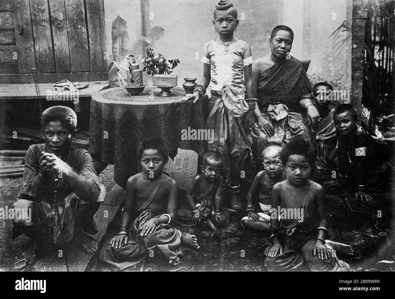 Cambodia: A Cambodian family, photographed at their home in Prey Veng in 1928.  Under the French protectorate, the colonial authorities saw potential of the Prey Veng region in terms of agriculture and fishing and its proximity to the French colony of Cochinchina. Mass deforestation took place to create land for agriculture. Nevertheless, when the Khmer Rouge took power in 1975, the province experienced its first famine. As the Vietnamese army advanced to Phnom Penh in January 1979, the region became one of the first areas of Cambodia liberated from the Khmer Rouge. Stock Photo