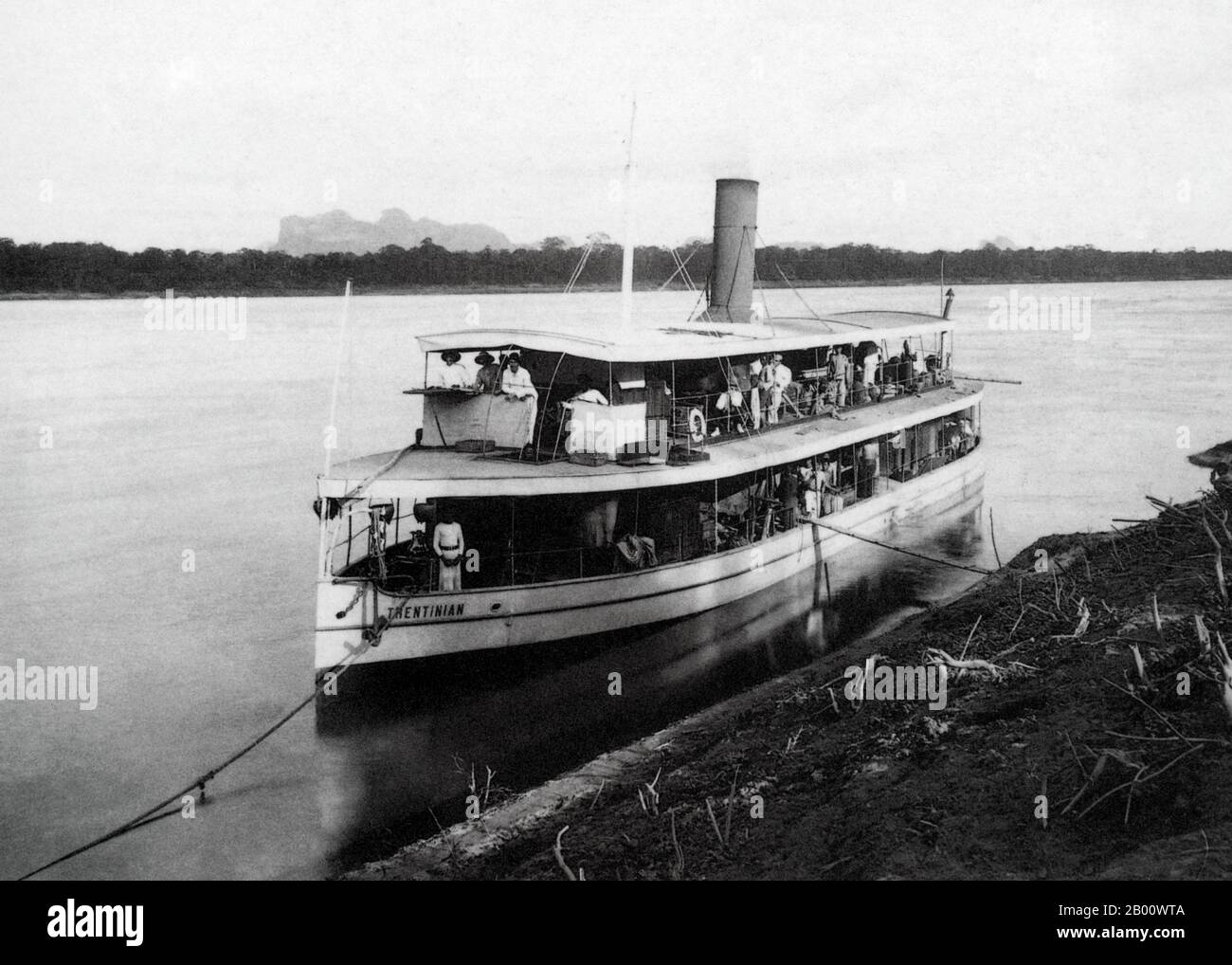 Laos: The launch of the steam-powered ‘Le Trentinian’ in 1897. The steamer operated a freight and passenger service between Vientiane and Savannakhet on the Mekong River.   Vientiane, formerly Sri Sattanak, was razed to the ground and looted by Siamese armies in 1827. The city was left in grave disrepair and became overgrown and nearly unpopulated until the French colonists arrived and took over the region in 1893. Vientiane became the capital of the French protectorate of Laos in 1899 and was rebuilt with renovated Buddhist temples surrounded by French architecture. Stock Photo