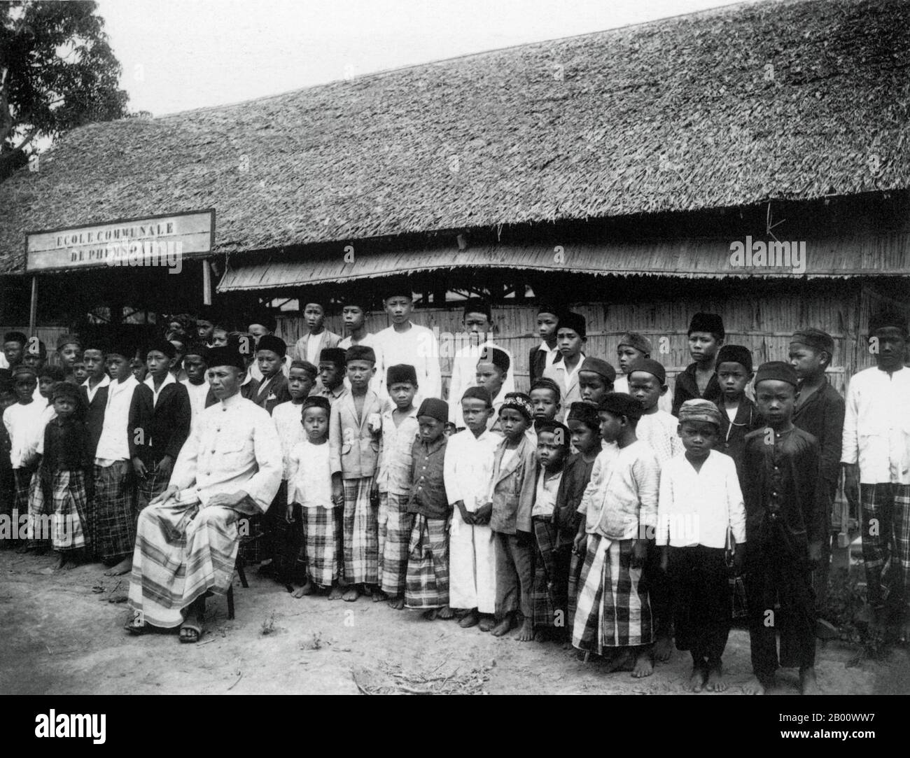 Vietnam: A 1918 photograph of a predominantly Cham-Malay Muslim primary school in the Chau Doc area of the Mekong delta, then part of Cochinchina.  Cochinchina is a region encompassing the southern third of Vietnam including Saigon/Ho Chi Minh City and was a French colony from 1862 to 1948. The later state of South Vietnam was created in 1954 by combining Cochinchina with southern Annam. The Cham people are remnants of the Kingdom of Champa (7th to 15th centuries). They are nowadays concentrated between Kampong Cham Province in Cambodia and areas in central and southeastern Vietnam. Stock Photo