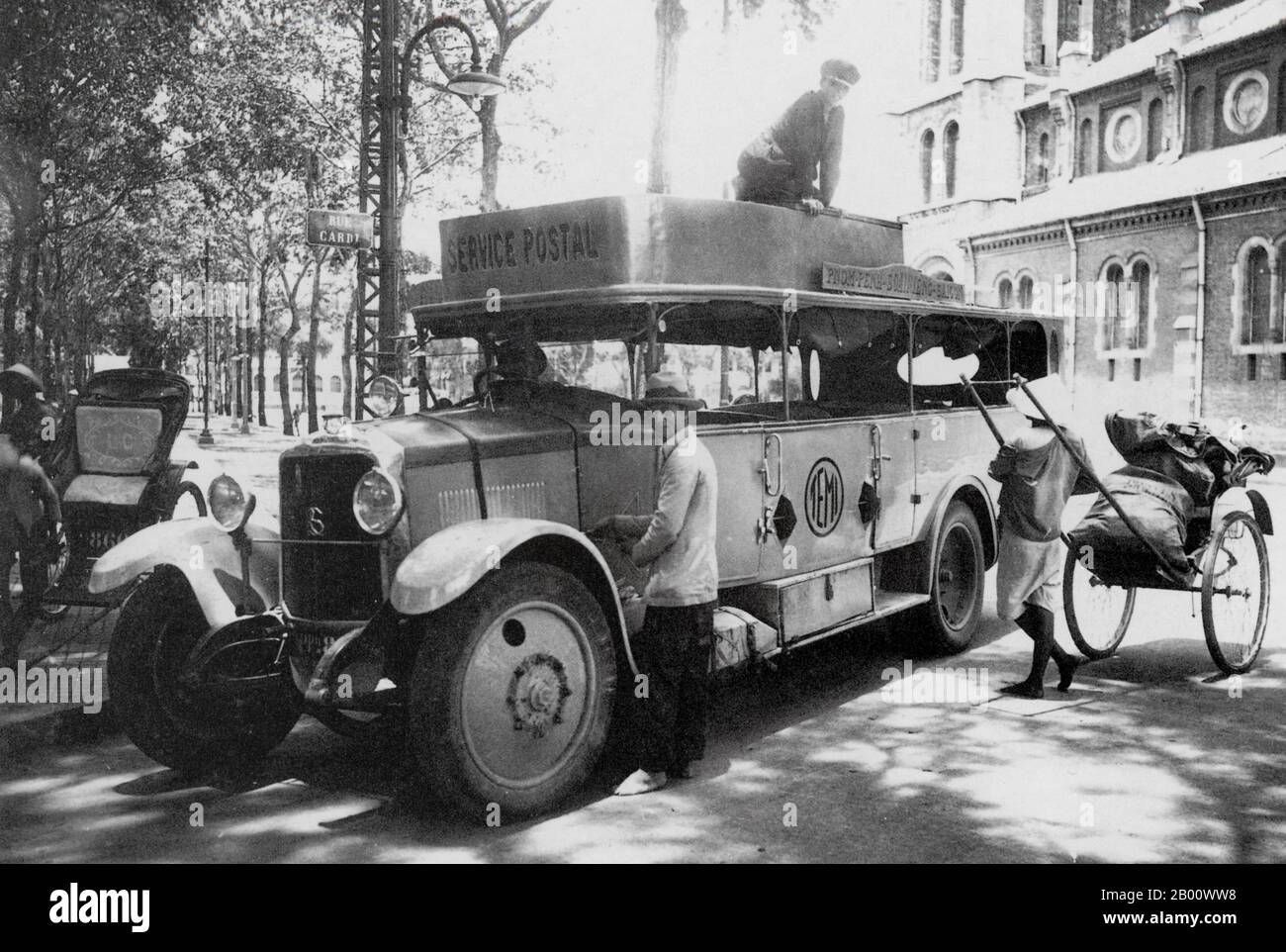 Cambodia/Vietnam: A 1927 photograph of a postal service vehicle which delivered mail between Phnom Penh and Saigon.  Situated on the banks of the Tonle Sap, Mekong and Bassac rivers, Phnom Penh is an ideal location for a trading centre and capital city. It is today home to more than 2 million of Cambodia's 14 million population. Phnom Penh first became the capital of Cambodia after Ponhea Yat, the last king of the Khmer Empire, was forced to flee Angkor Thom after it was seized by the Siamese army in 1393. Phnom Penh remained the royal capital until 1505 when it was abandoned for 360 years. Stock Photo