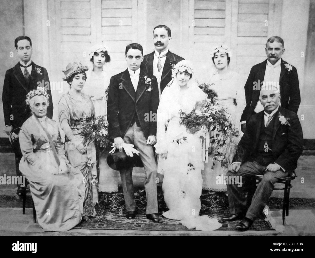 Singapore: A wedding between Singaporeans of Armenian descent, c. 1910.  The Armenians in Singapore, who numbered as many as 100 families at their peak in the 1880s, have now moved on or become part of the wider Singapore community. The Armenian Apostolic Church of St Gregory the Illuminator on Armenian Street, the first church ever built in Singapore, remains today. By the 18th century, Armenian communities had established themselves in India (particularly Kolkata) Myanmar, the Malay Peninsula (particularly Penang and Malacca), and Java. Stock Photo
