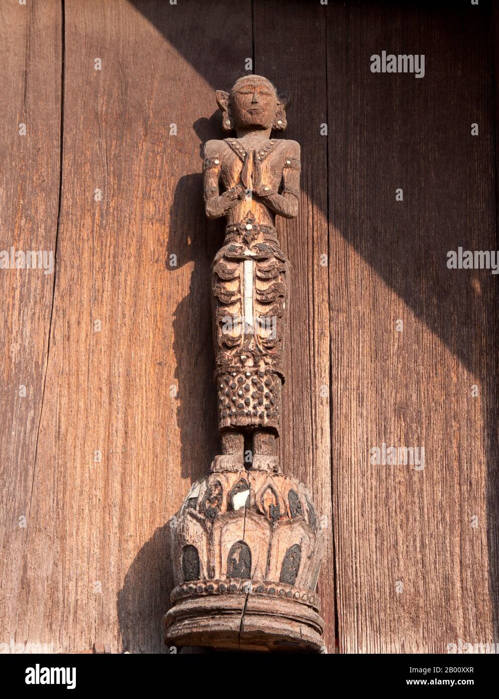 Thailand: Temple adornment, Wat Phra That Lampang Luang, northern Thailand.  Wat Phra That Lampang Luang (วัดพระธาตุลำปางหลวง), the ‘Temple of the Great Buddha Relic of Lampang’, dates back to the 15th century and is a wooden Lanna-style temple found in the Ko Kha district of Lampang Province. It stands atop an artificial mound, and is surrounded by a high and massive brick wall. The temple itself doubles as a wiang (fortified settlement), and was built as a fortified temple. Stock Photo