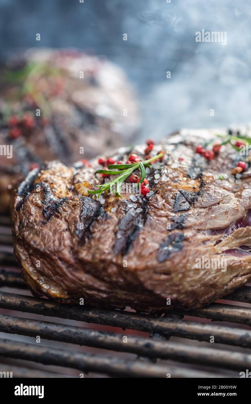 Grilled steaks flame steak rosemary hi-res stock photography and images ...