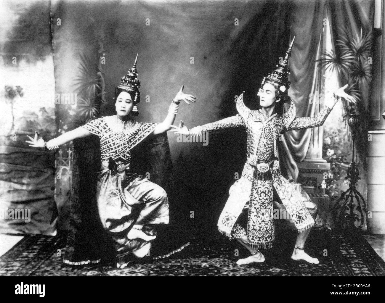 Thailand: An 1896 photograph of two classical Siamese dancers in Udon Thani, now located in northeastern Thailand.  Siamese dance is an elegant art form refined over centuries and supported by regal patronage. The Thais reputedly first acquired a dance troupe when, in 1431 CE, they conquered the ancient Khmer capital of Angkor and took as part of their booty an entire corps de ballet - dancers whose performances had once been seen as a symbolic link between nature, earth and the realm of the gods. The two major forms of Thai classical dance drama are 'khon' and 'lakon nai'. Stock Photo