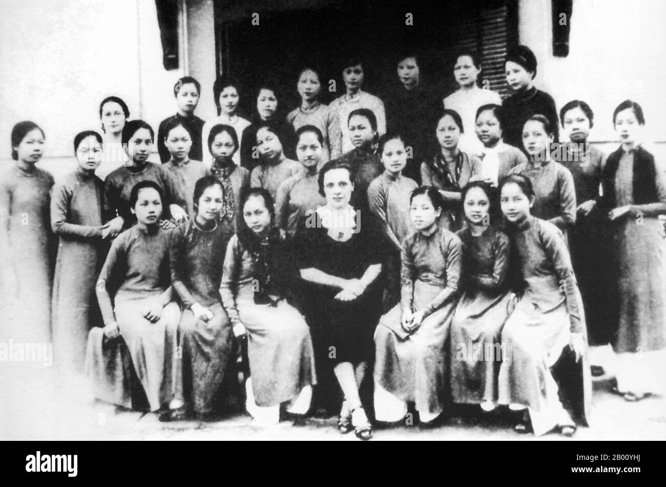 Vietnam: The first generation of female students at Dong Khanh High School in Hue (early 20th century).  Between 1802 and 1945, Hue was the imperial capital of the feudal Nguyen Dynasty, which dominated much of southern Vietnam. In 1775 when Trinh Sam captured it, it was known as Phu Xuan. In 1802, Nguyen Phuc Anh (later Emperor Gia Long) succeeded in establishing his control over the whole of Vietnam, thereby making Hue the national capital. The French administration placed the boy emperor Duy Tan on the throne in 1907, replacing his father Emperor Thanh Thai, who opposed French colonial rule Stock Photo