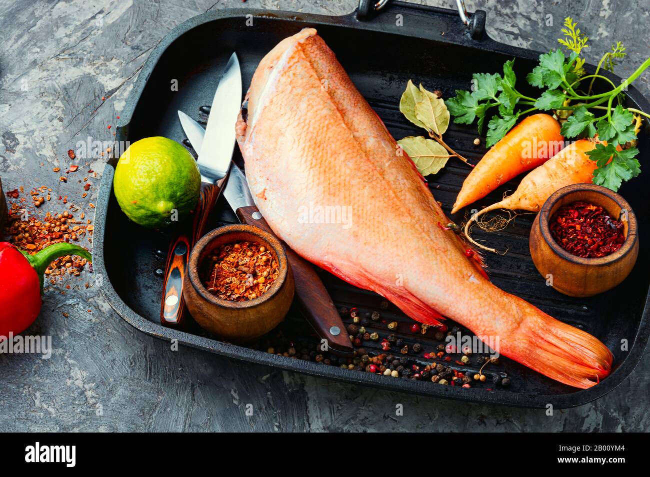 Whole raw fresh red perch or seabass. Stock Photo