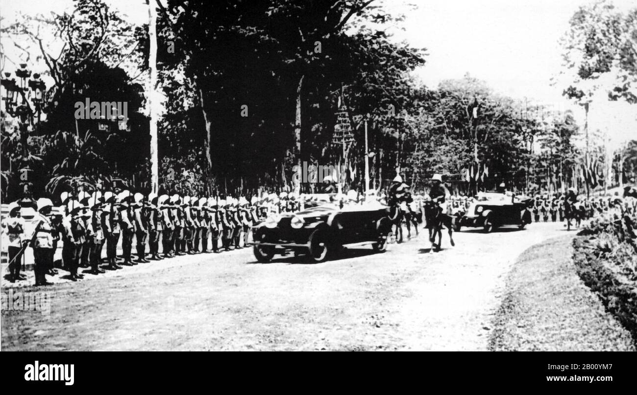 Vietnam: Honour guard on parade outside Norodom Palace, Saigon (1925).  Originally the French governor's palace, then Norodom Palace, then Independence Palace, the magnificent original French building was knocked down to make way for Reunification Palace, which was built on the same site between 1962 -66. It is today a famous landmark in Ho Chi Minh City and a popular museum and tourist attraction. The present building was designed by architect Ngo Viet Thu and was the home and workplace of the President of South Vietnam during the US-Vietnam War. Stock Photo