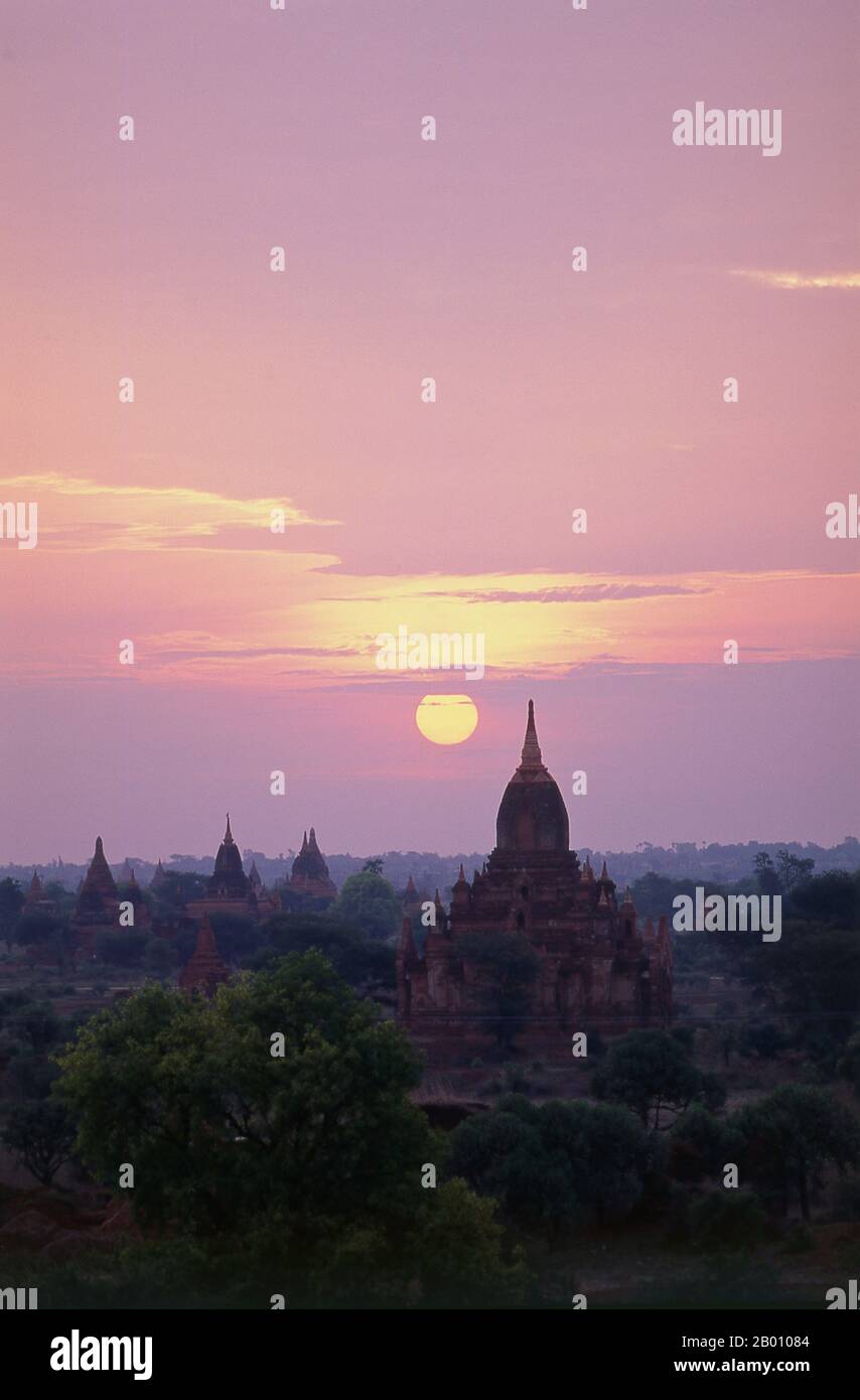 Burma: Dawn over Bagan (Pagan) Ancient City.  Bagan, formerly Pagan, was mainly built between the 11th century and 13th century. Formally titled Arimaddanapura or Arimaddana (the City of the Enemy Crusher) and also known as Tambadipa (the Land of Copper) or Tassadessa (the Parched Land), it was the capital of several ancient kingdoms in Burma. Stock Photo