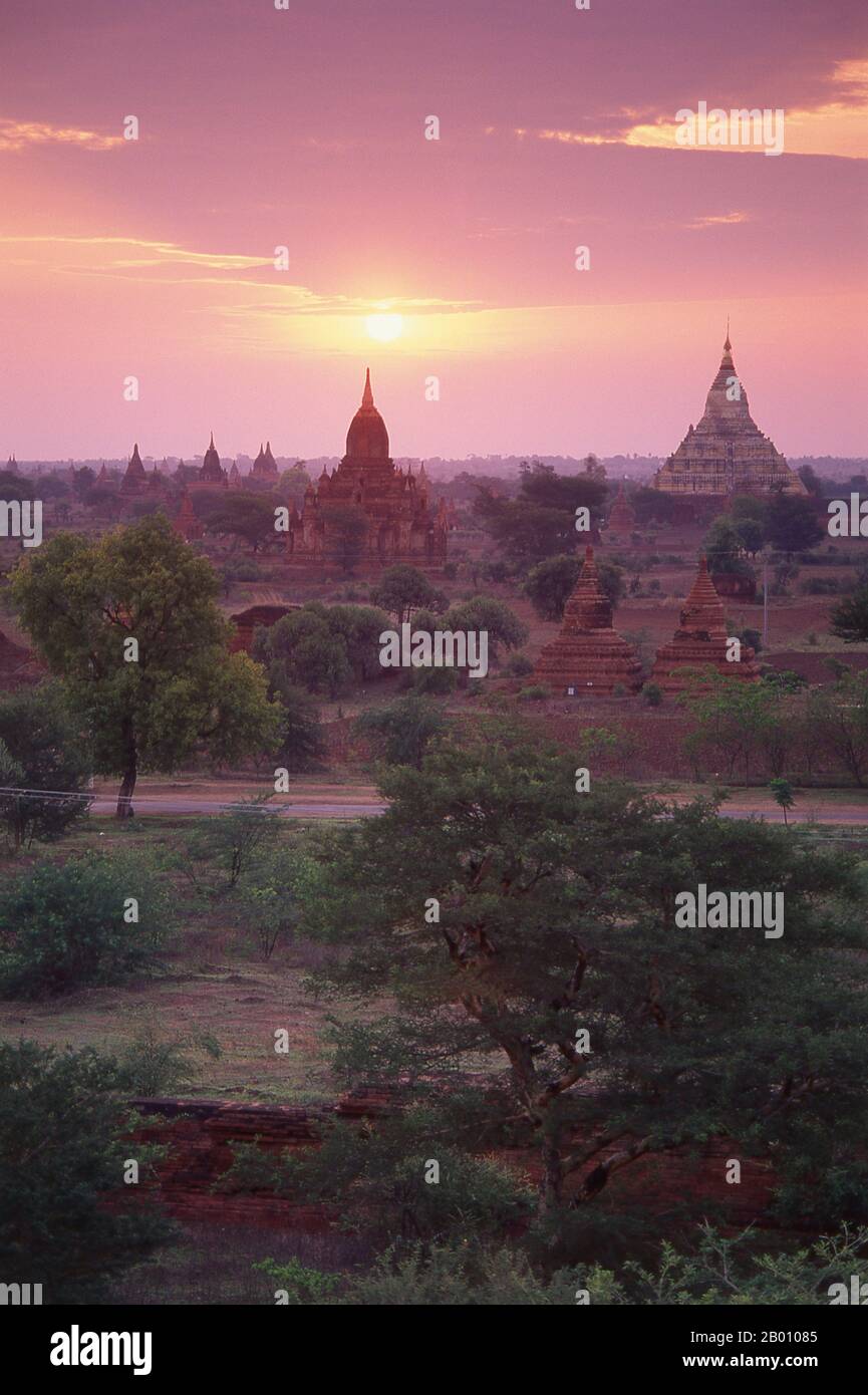 Burma: Dawn over Bagan (Pagan) Ancient City. Bagan, formerly Pagan, was mainly built between the 11th century and 13th century. Formally titled Arimaddanapura or Arimaddana (the City of the Enemy Crusher) and also known as Tambadipa (the Land of Copper) or Tassadessa (the Parched Land), it was the capital of several ancient kingdoms in Burma. Stock Photo
