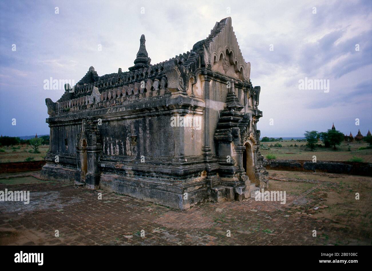 Burma: Upali Thein, Bagan (Pagan) Ancient City. Upali Thein is a Buddhist ordination hall situated between Bagan and Nyaung U in Myanmar. Built during the reign of King Anawrahta (1014-1077), its well-preserved interior frescoes were made in 1794-1795 during the Konbaung Dynasty. Bagan, formerly Pagan, was mainly built between the 11th century and 13th century. Formally titled Arimaddanapura or Arimaddana (the City of the Enemy Crusher) and also known as Tambadipa (the Land of Copper) or Tassadessa (the Parched Land), it was the capital of several ancient kingdoms in Burma. Stock Photo