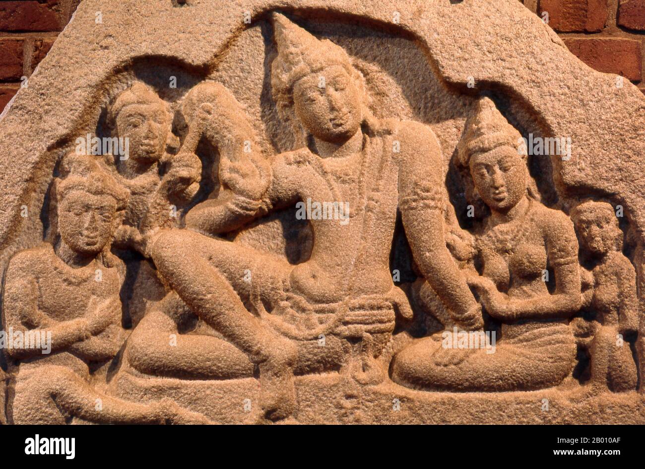 Sri Lanka: Frieze of royal family, Isurumuniya temple museum, Anuradhapura.  Isurumuniya Vihara is a rock temple built during the reign of King Devanampiya Tissa (r. 307 - 267 BCE).  Anuradhapura is one of Sri Lanka's ancient capitals and famous for its well-preserved ruins. From the 4th century BCE until the beginning of the 11th century CE it was the capital. During this period it remained one of the most stable and durable centers of political power and urban life in South Asia. The ancient city, considered sacred to the Buddhist world, is today surrounded by monasteries. Stock Photo