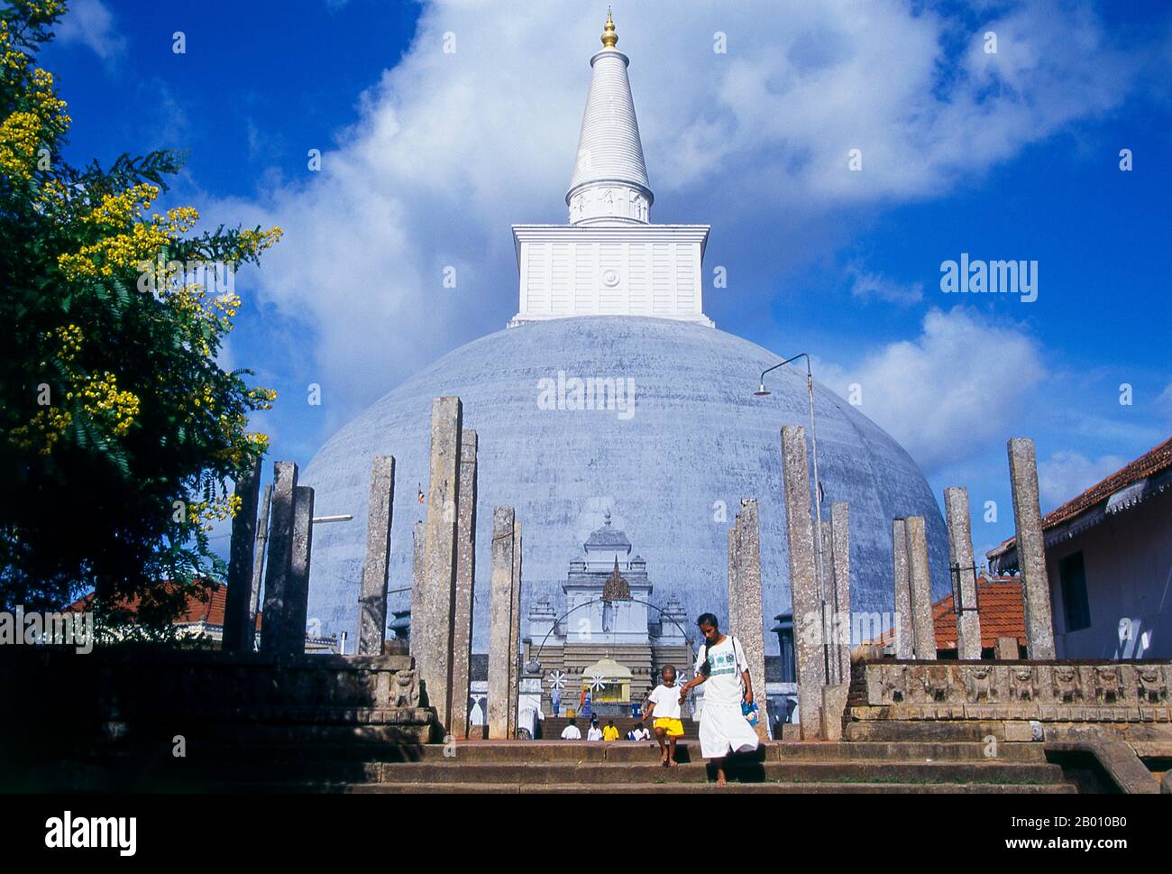 Sri Lanka: Ruvanvelisaya Dagoba, Anuradhapura.  Ruvanvelisaya Dagoba was built by King Dutugemunu (r. 161 - 137 BCE).  Anuradhapura is one of Sri Lanka's ancient capitals and famous for its well-preserved ruins. From the 4th century BCE until the beginning of the 11th century CE it was the capital. During this period it remained one of the most stable and durable centers of political power and urban life in South Asia. The ancient city, considered sacred to the Buddhist world, is today surrounded by monasteries covering an area of over sixteen square miles (40 km²). Stock Photo