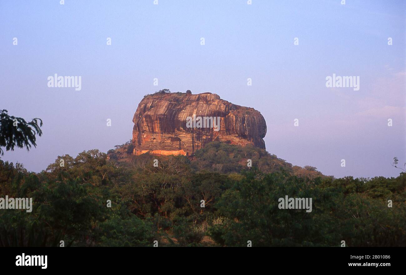 Sri Lanka: Sigiriya (Lion's Rock) in the late afternoon sun.  Sigiriya (Lion's Rock) was built during the reign of King Kasyapa I (CE 477 – 495), and is a World Heritage Site. Stock Photo