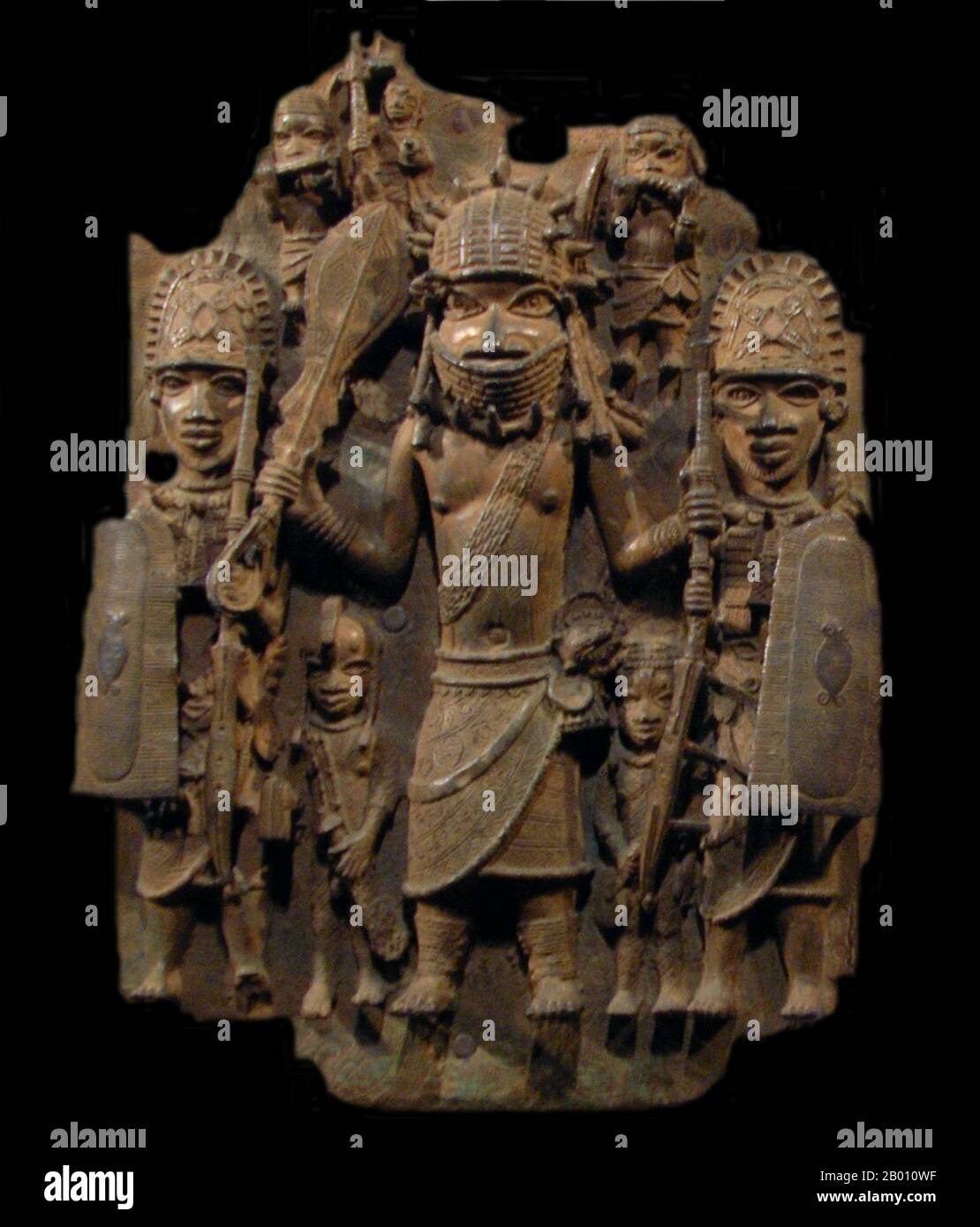 Nigeria: Warrior with two attendants, followers in background. Bronze plaque, Benin Kingdom, 16th-18th centuries.  The Benin Empire (1440–1897) was a pre-colonial African state in what is now modern Nigeria. It is not to be confused with the modern-day country called Benin (and formerly called Dahomey). Stock Photo