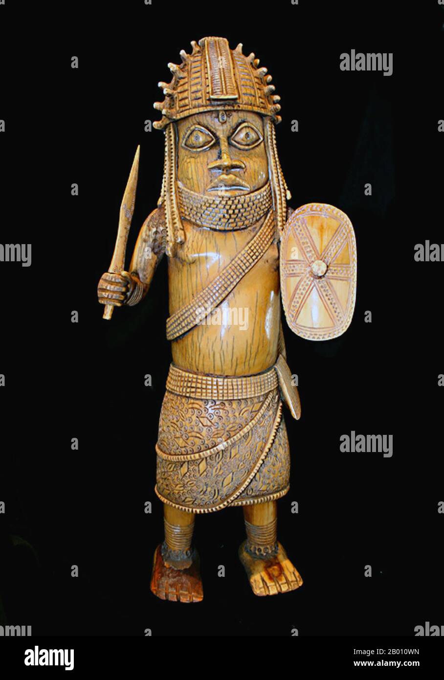 Nigeria: Ivory figurine of a warrior, Benin Kingdom, 19th or 20th century.  The Benin Empire (1440–1897) was a pre-colonial African state in what is now modern Nigeria. It is not to be confused with the modern-day country called Benin (and formerly called Dahomey). Stock Photo