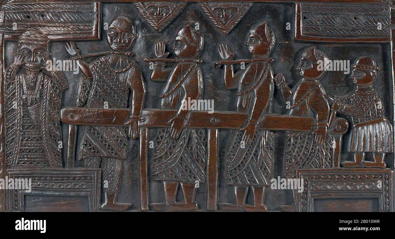 Nigeria: Carved wooden panel from a Kingdom of Benin stool showing captives in restraints.  The Benin Empire (1440–1897) was a pre-colonial African state in what is now modern Nigeria. It is not to be confused with the modern-day country called Benin (and formerly called Dahomey). Stock Photo