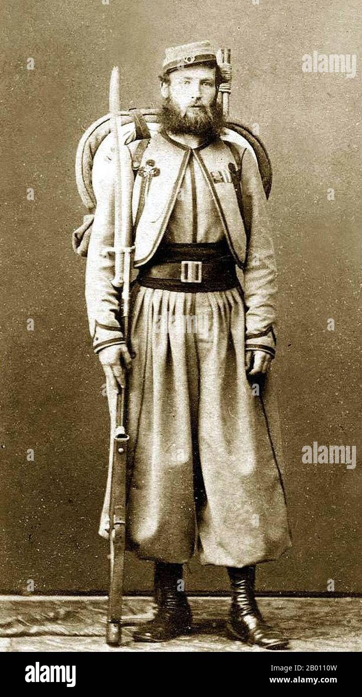 Italy: Vatican Zouave of Major O'Reilly's Papal Brigade, and a veteran of the battles against Garibaldi. Fully armed and equipped with a .71 cal. Model 1842 French Rifle with sword bayonet, and backpack. Photo by Fratelli D'Allesandri (19th century), c. 1865.  Zouave was the title given to certain light infantry regiments in the French Army, normally serving in French North Africa between 1831 and 1962. The name was also adopted during the 19th century by units in other armies, especially volunteer regiments raised for service in the American Civil War. Stock Photo