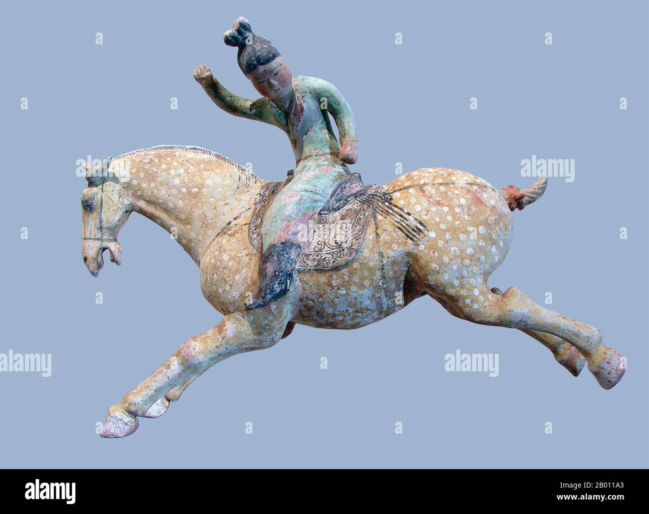 China: Tang dynasty ceramic horse with polo player, early 8th century.  The Tang Dynasty (Chinese: 唐朝; pinyin: Táng Cháo; June 18, 618 – June 1, 907) was an imperial dynasty of China preceded by the Sui Dynasty and followed by the Five Dynasties and Ten Kingdoms Period. It was founded by the Li (李) family, who seized power during the decline and collapse of the Sui Empire. The dynasty was interrupted briefly by the Second Zhou Dynasty (October 8, 690 – March 3, 705) when Empress Wu Zetian seized the throne, becoming the first and only Chinese empress regnant, ruling in her own right. Stock Photo
