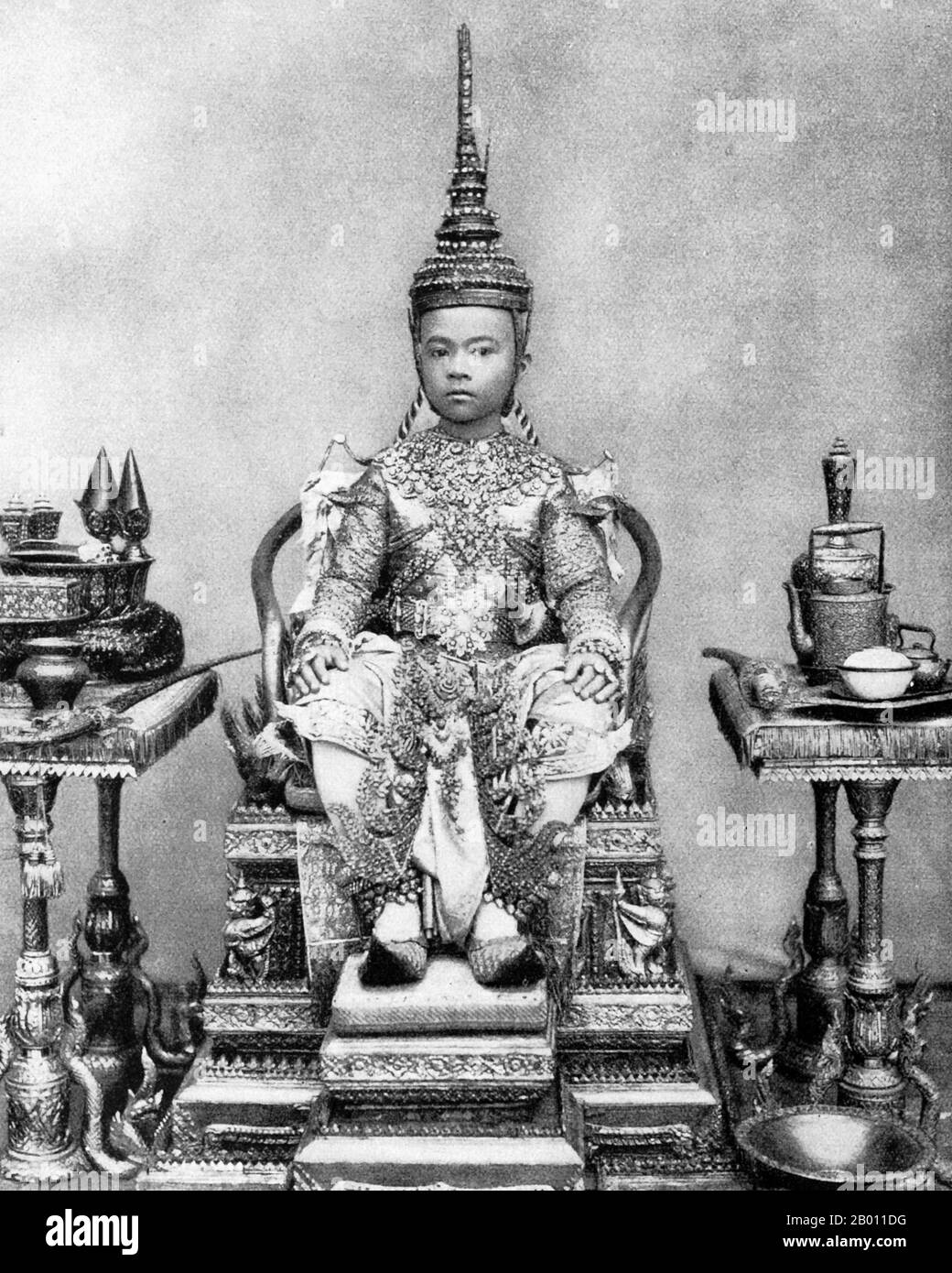 Thailand: A royal prince dressed and adorned for his tonsure ceremony, Siam, late 19th century.  In 19th-century Siam, almost every young male in the royal family entered the ‘sangha’ or Buddhist monkhood as a rite of passage. The tonsure ceremony was an initial act of this rite as all novices must have their heads shaved to enter the monastic order. The tradition survives to this day, not just among Thai royalty, but at all levels of society. Stock Photo