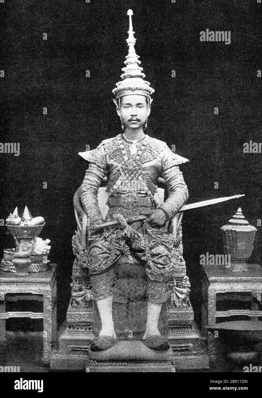 Thailand: King Chulalongkorn sits on his throne dressed in his coronation robes, c. 1880.  King Chulalongkorn, Rama V (1853–1910) was the fifth monarch of Siam under the House of Chakri. He acceded to the throne at the age of 15 after the death of his father, King Mongkut, Rama IV. King Chulalongkorn is considered one of the greatest kings of Siam. His reign was characterized by the modernization of the country, including major governmental and social reforms. He is also credited with saving Siam from being colonized. Stock Photo