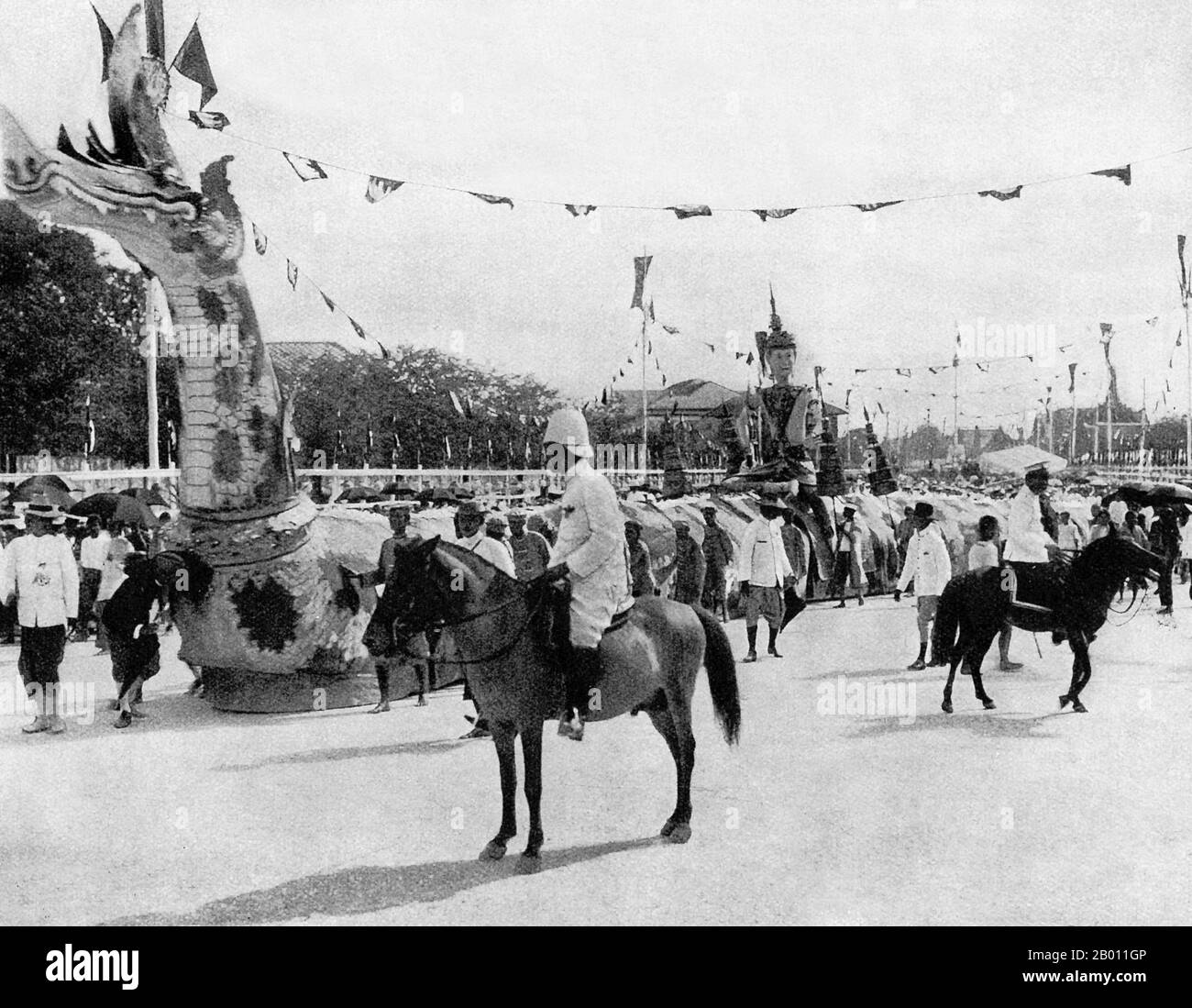 Thailand: A dragon forms part of the procession for King Chulalongkorn’s 40th jubilee celebrations in 1908.  King Chulalongkorn, Rama V (1853–1910) was the fifth monarch of Siam under the House of Chakri. He acceded to the throne in 1868 at the age of 15 after the death of his father, King Mongkut, Rama IV. King Chulalongkorn is considered one of the greatest kings of Siam. His reign was characterized by the modernization of the country, including major governmental and social reforms. He is also credited with saving Siam from being colonized. Stock Photo