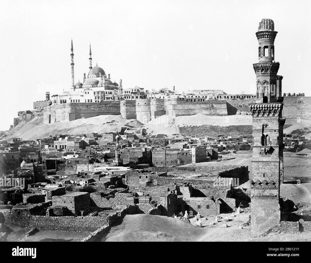 Egypt: The Saladin Citadel, Cairo (Arabic: Qala 'at Salah ad-Din). Photo by Antonio Beato (1835-1906), c. 1870-1890.  The Saladin Citadel of Cairo is a medieval Islamic fortification in Cairo, Egypt. The location, part of the Muqattam hill near the center of Cairo, was once famous for its fresh breeze and grand views of the city. It is now a preserved historic site, with mosques and museums.The Citadel was fortified by the Ayyubid ruler Salah al-Din (Saladin) between 1176 and 1183 CE, to protect it from the Crusaders. Stock Photo