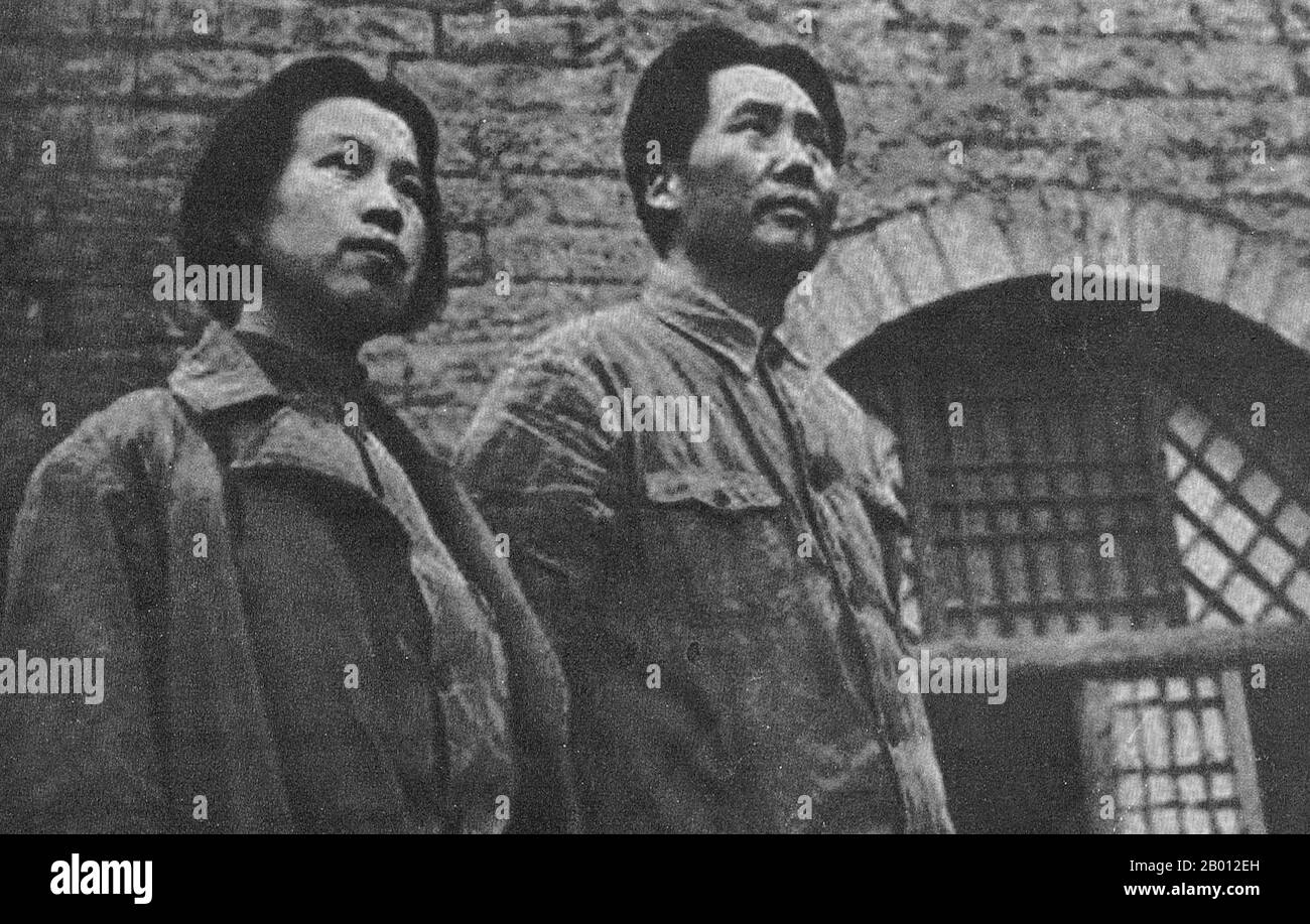 China: Jiang Qing (1914-1991), also known as Madame Mao, together with her husband Mao Zedong in Yan'an, c. 1938.  Jiang Qing (Chiang Ch'ing, March 1914  – May 14, 1991) was the pseudonym that was used by Chinese leader Mao Zedong's last wife and major Communist Party of China power figure.  She went by the stage name Lan Ping during her acting career, and was known by various other names during her life. She married Mao in Yan'an in November 1938, and is sometimes referred to as Madame Mao in Western literature, serving as Communist China's first first lady. Stock Photo