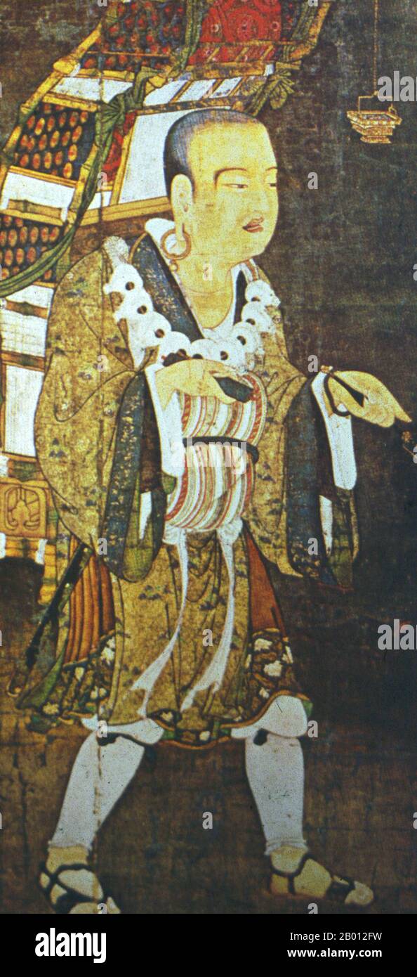 China/Japan: Xuanzang (Hsuan-tsang, c. 602 – 664) was a famous Chinese Buddhist monk, scholar, traveler and translator who travelled to India seeking Buddhist knowledge during the early Tang Dynasty. Hanging scroll painting, Kamakura Period (14th century).  Born in Henan province of China in 602 or 603, from boyhood Xuanzang took to reading sacred books, including the Chinese Classics and the writings of the ancient sages. While residing in the city of Luoyang, he entered Buddhist monkhood at the age of thirteen. He travelled throughout China in search of sacred books of Buddhism. Stock Photo