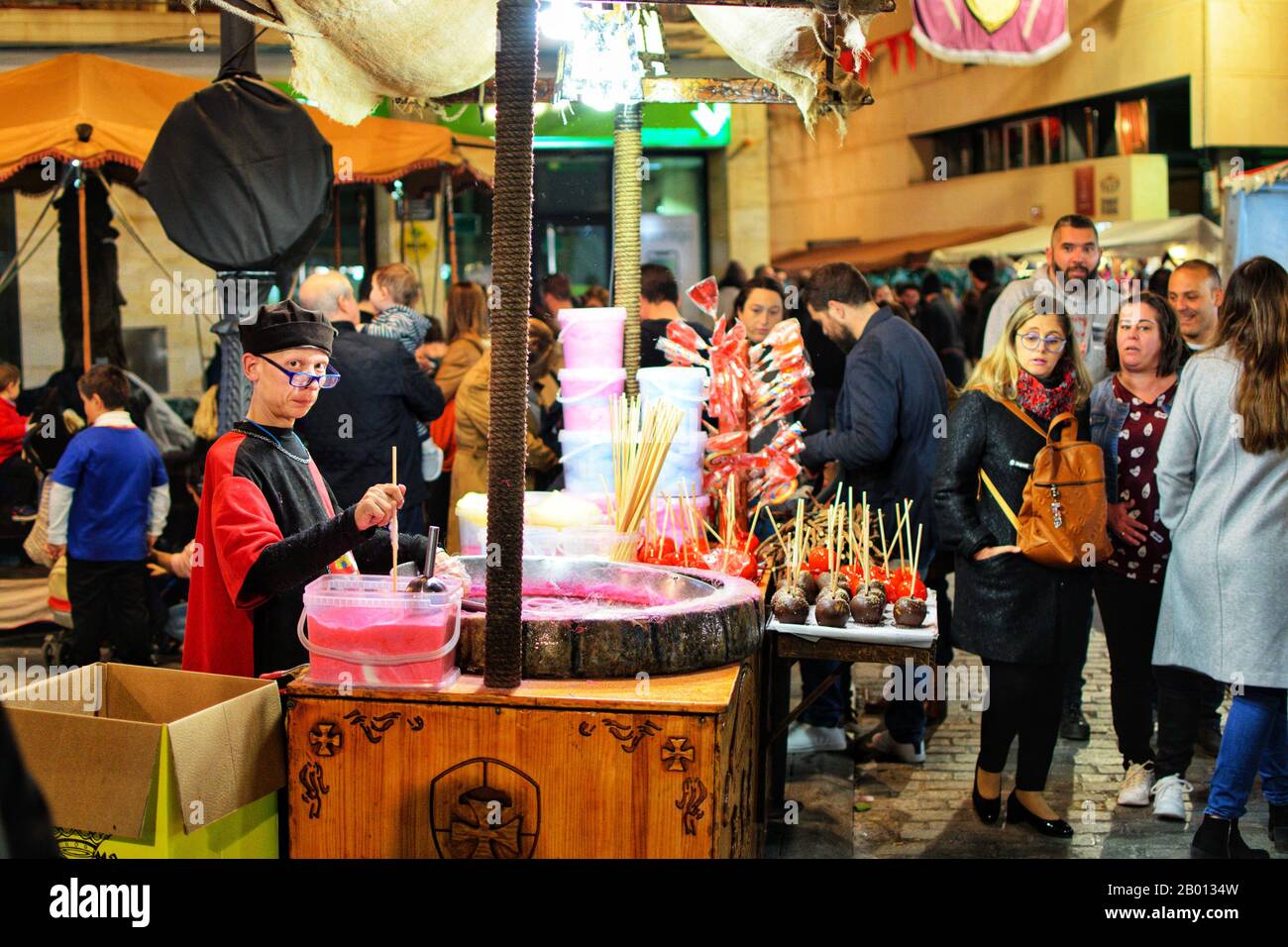 Orihuela, Spain, January, 2020: The seller of cotton candy at work. Sale of cotton candy on holiday Stock Photo