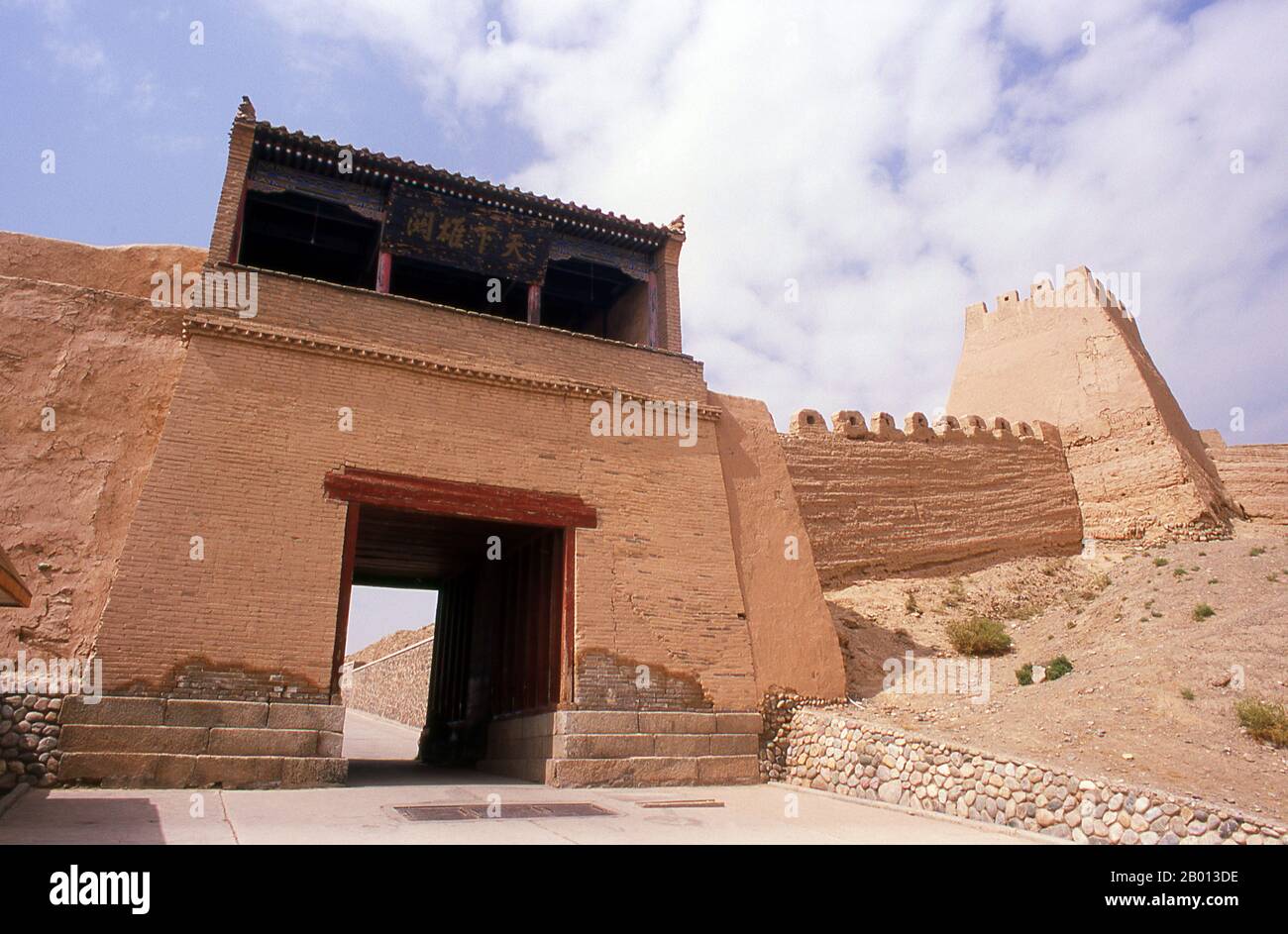 China: Outer wall tower next to the front gate, Jiayuguan Fort, Jiayuguan, Gansu.  Jiayuguan, the ‘First and Greatest Pass under Heaven’, was completed in 1372 on the orders of Zhu Yuanzhang, the first Ming Emperor (1368-1398), to mark the end of the Ming Great Wall. It was also the very limits of Chinese civilisation, and the beginnings of the outer ‘barbarian’ lands. For centuries the fort was not just of strategic importance to Han Chinese, but of cultural significance as well. This was the last civilised place before the outer darkness. Stock Photo