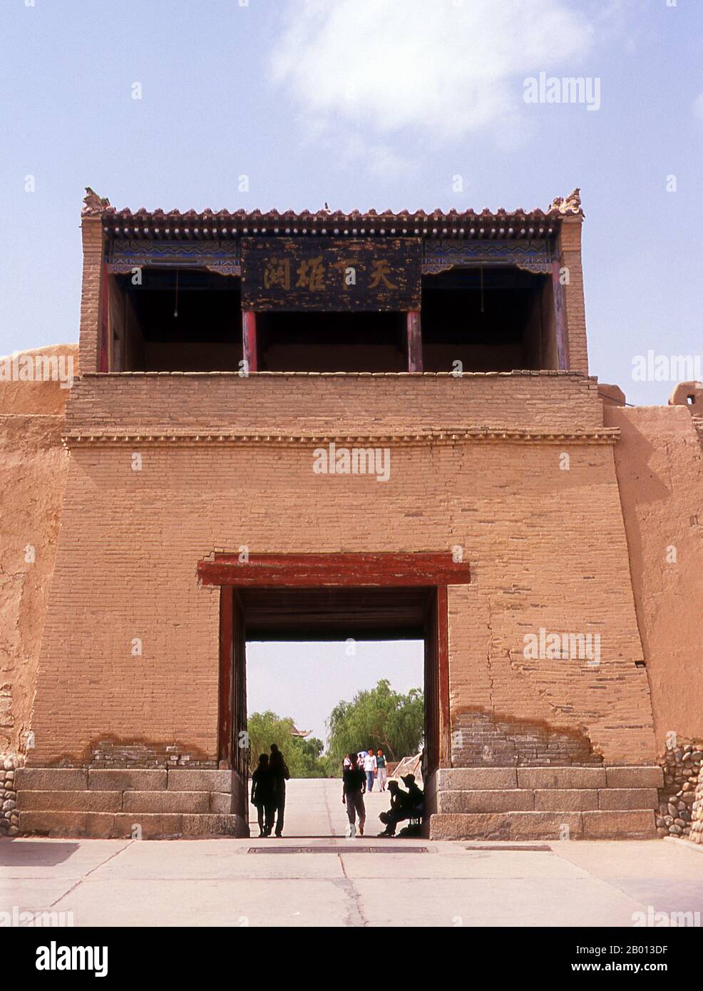 China: Outer wall tower next to the front gate, Jiayuguan Fort, Jiayuguan, Gansu.  Jiayuguan, the ‘First and Greatest Pass under Heaven’, was completed in 1372 on the orders of Zhu Yuanzhang, the first Ming Emperor (1368-1398), to mark the end of the Ming Great Wall. It was also the very limits of Chinese civilisation, and the beginnings of the outer ‘barbarian’ lands. For centuries the fort was not just of strategic importance to Han Chinese, but of cultural significance as well. This was the last civilised place before the outer darkness. Stock Photo