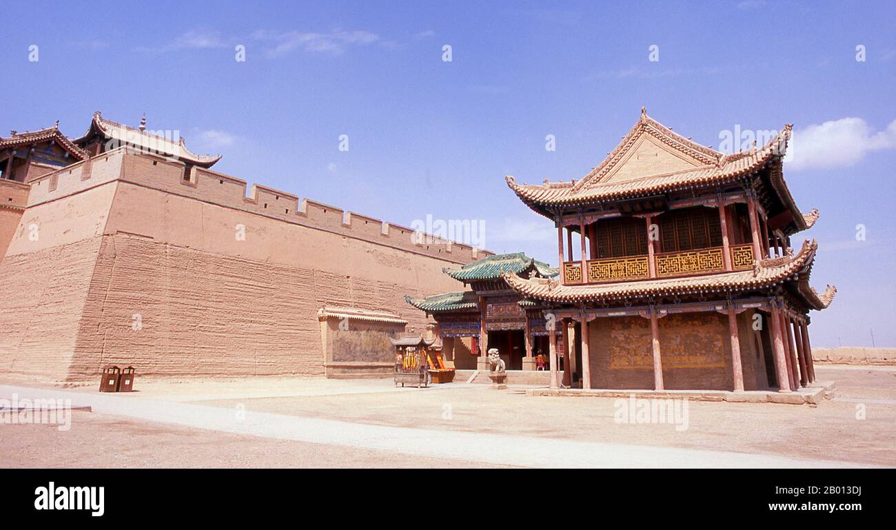 China: Outer wall tower next to the front gate, Jiayuguan Fort, Jiayuguan, Gansu.  Jiayuguan, the ‘First and Greatest Pass under Heaven’, was completed in 1372 on the orders of Zhu Yuanzhang, the first Ming Emperor (1368-1398), to mark the end of the Ming Great Wall. It was also the very limits of Chinese civilisation, and the beginnings of the outer ‘barbarian’ lands. For centuries the fort was not just of strategic importance to Han Chinese, but of cultural significance as well. This was the last civilised place before the outer darkness. Stock Photo