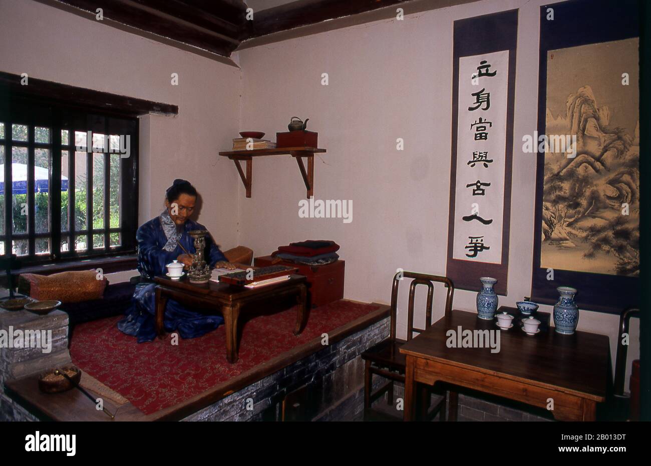 China: The old accommodation used by generals and their families now show tableaux of life back in Ming Dynasty times, Jiayuguan Fort, Jiayuguan, Gansu.  Jiayuguan, the ‘First and Greatest Pass under Heaven’, was completed in 1372 on the orders of Zhu Yuanzhang, the first Ming Emperor (1368-98), to mark the end of the Ming Great Wall. It was also the very limits of Chinese civilisation, and the beginnings of the outer ‘barbarian’ lands. For centuries the fort was not just of strategic importance to Han Chinese, but of cultural significance as well. Stock Photo