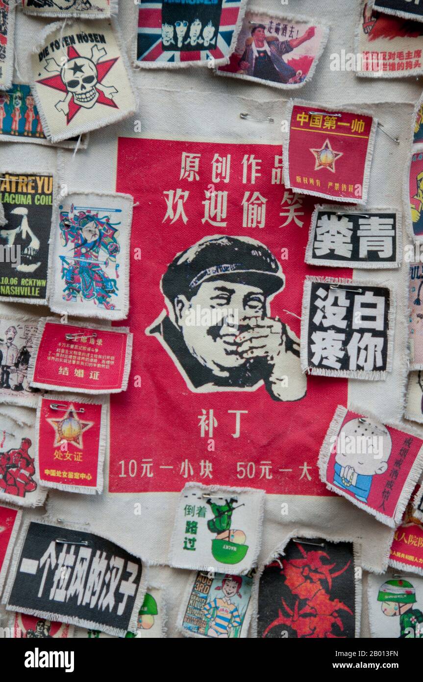 China: Mao memorabilia mixed in with modern popular icons, shop on Fuxing Lu, Old Dali, Dali.  Dali is the ancient capital of both the Bai kingdom of Nanzhao, which flourished in the area during the 8th and 9th centuries, and the Kingdom of Dali, which reigned from 937-1253. Situated in a once significantly Muslim part of South China, Dali was also the center of the Panthay Rebellion against the reigning imperial Qing Dynasty from 1856-1863. Stock Photo