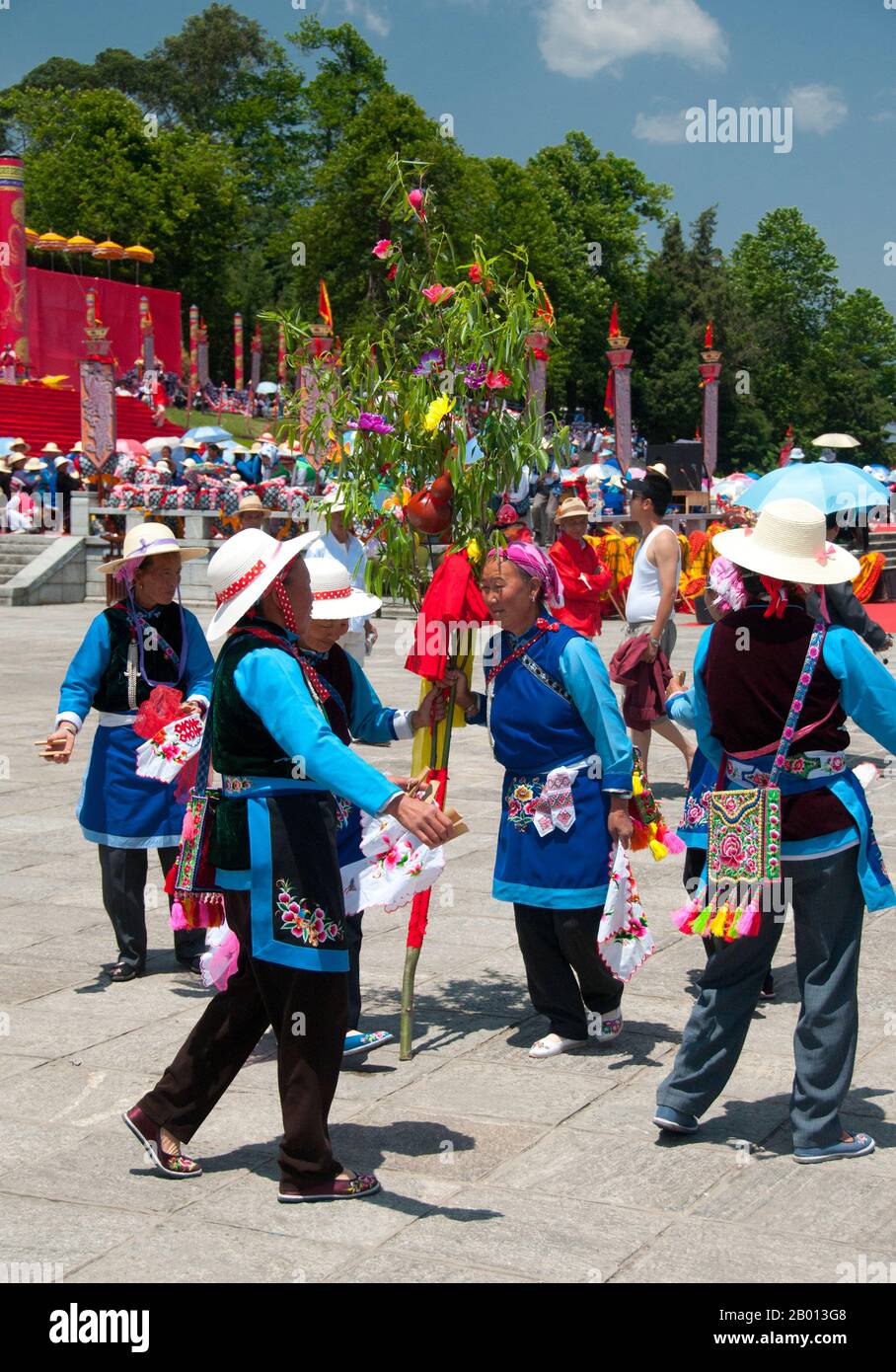 China: Bai women dancing at the Bai music and dance festival at San Ta Si (Three Pagodas), Dali, Yunnan.  The Bai or Baip are one of the 56 ethnic groups officially recognized by the People's Republic of China. Bai people live mostly in the provinces of Yunnan (Dali area), and in neighboring Guizhou (Bijie area) and Hunan (Sangzhi area) provinces.  Dali is the ancient capital of both the Bai kingdom Nanzhao, which flourished in the area during the 8th and 9th centuries, and the Kingdom of Dali, which reigned from 937-1253. Dali is situated in a once significantly Muslim part of South China. Stock Photo