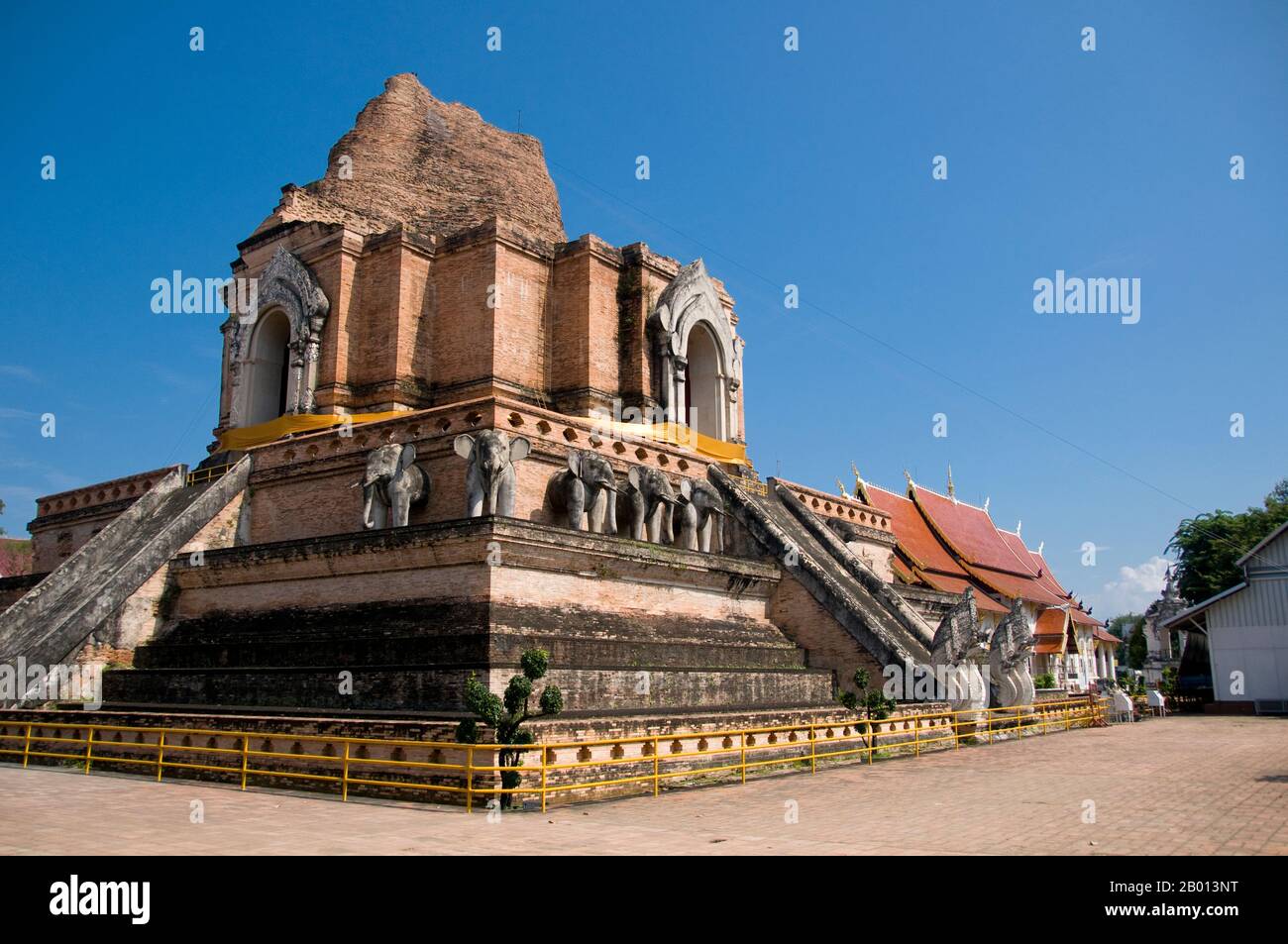 Thailand: The main chedi, Wat Chedi Luang, Chiang Mai.  Wat Chedi Luang translates literally from the Thai as ‘Monastery of the Great Stupa’. Construction of the temple began at the end of the 14th century when the Lan Na Kingdom was in its prime. King Saen Muang Ma (1385-1401) intended it as the site of a great reliquary to enshrine the ashes of his father, King Ku Na (1355-85). Today it is the the site of the Lak Muang or City Pillar. The annual Inthakin ceremony occurs within the confines of the temple. Stock Photo