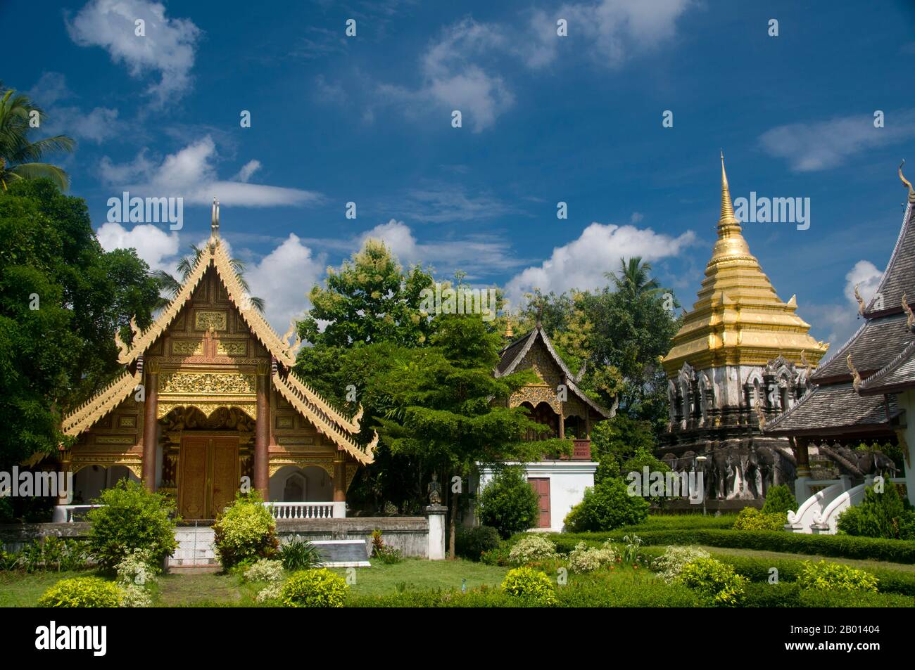 vThailand: Ubosot (ordination hall), ho trai (library) and chedi, Wat Chiang Man, Chiang Mai.  Wat Chiang Man (Chiang Mun) was built in 1297 CE and is thought to be Chiang Mai's oldest temple. It was built on the spot which had been used by King Mangrai as a camp during the construction of his new capital city Chiang Mai.  Chiang Mai  (meaning 'new city'), sometimes written as 'Chiengmai' or 'Chiangmai', is the largest and most culturally significant city in northern Thailand. King Mengrai founded the city of Chiang Mai in 1296, and it succeeded Chiang Rai as capital of the Lanna kingdom. Stock Photo