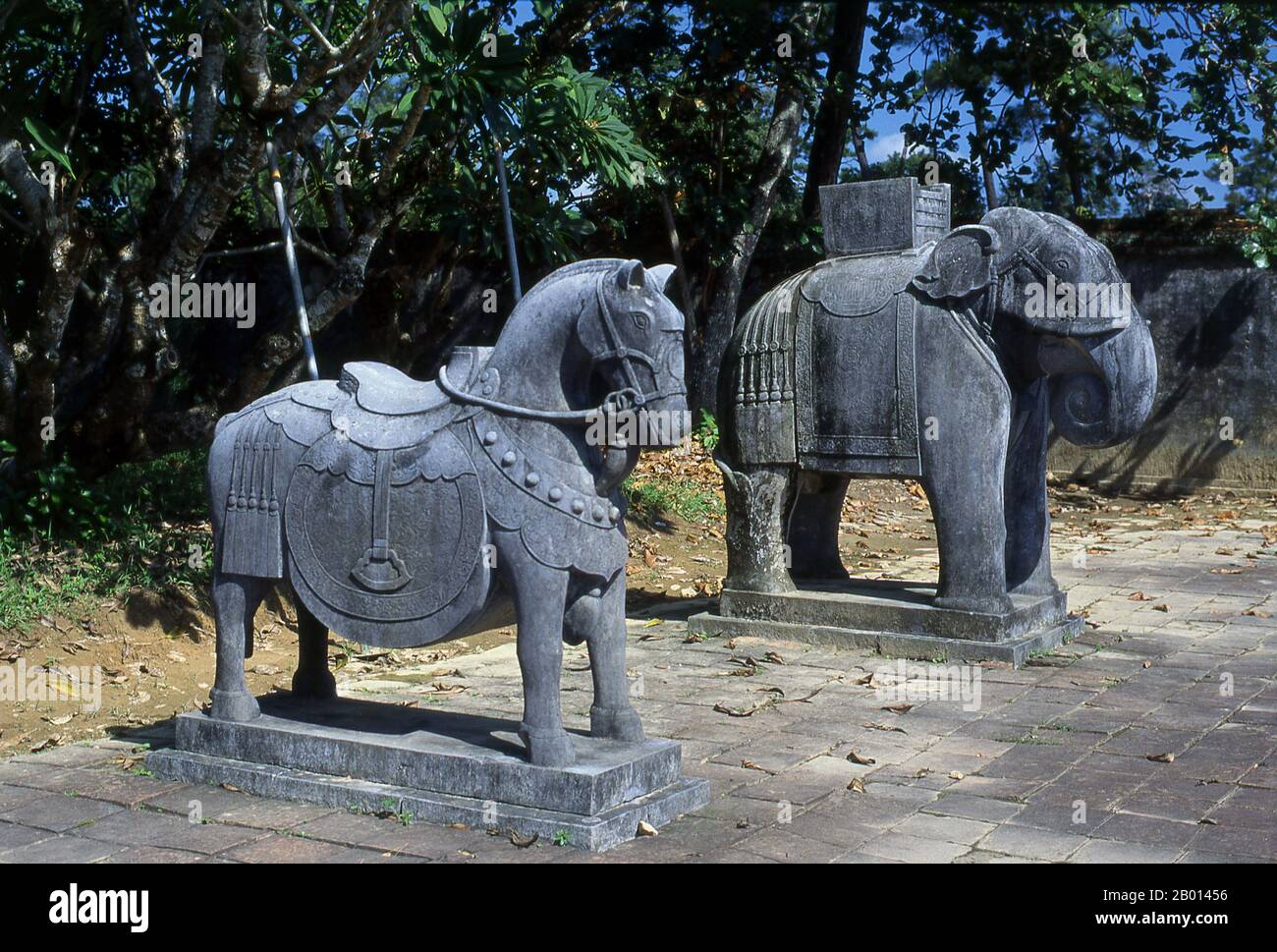 Vietnam: Guardian animal statues, Tomb of Emperor Minh Mang, Hue.  Minh Mạng (1791–1841) was the second emperor of the Nguyen Dynasty of Vietnam, reigning from 14 February 1820 until 20 January 1841. Minh Mang was a classicist who was regarded as one of Vietnam's most scholarly monarchs. He was known as a poet and was regarded as an emperor who cared sincerely about his country and paid great attention to its rule, to the extent of micromanaging certain policies. He pursued a sceptical policy to Christian missionaries, often trying to inhibit their activities by administrative means. Stock Photo