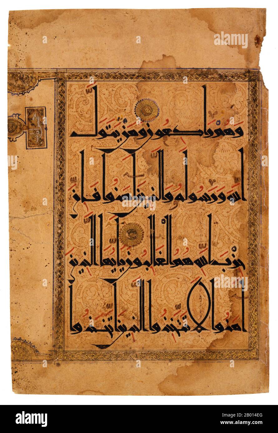 Iran: Illustrated page from an 11th century Qur'an written in Eastern Kufic script.  Eastern Kufic script is distinguished by tall upstrokes that often have left-facing serifs and curved downstrokes. The various diacritical marks that facilitate reading are carefully marked with red, blue, and black. Eastern Kufic was introduced in the 10th century at the same time as paper became the preferred material for Korans in the eastern Islamic world. Stock Photo