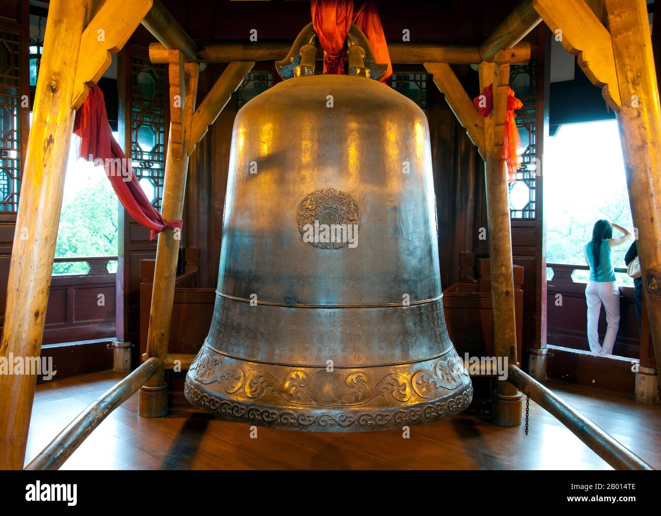 China: Bell in the Ten Thousand Buddha Pagoda, Du Fu Caotang (Du Fu's Thatched Cottage), Chengdu, Sichuan Province.  Du Fu (Dù Fǔ; Wade–Giles: Tu Fu, 712–770) was a prominent Chinese poet of the Tang Dynasty. Along with Li Bai (Li Bo), he is frequently called the greatest of the Chinese poets. In 759 Du Fu moved to Chengdu, built a thatched hut near the Flower Rinsing Creek and lived there for four years. The 'thatched hut' period was the peak of Du Fu's creativity. He wrote two hundred and forty poems, among them: 'My Thatched Hut was torn apart by Autumn Wind' and 'The Prime Minister of Shu' Stock Photo