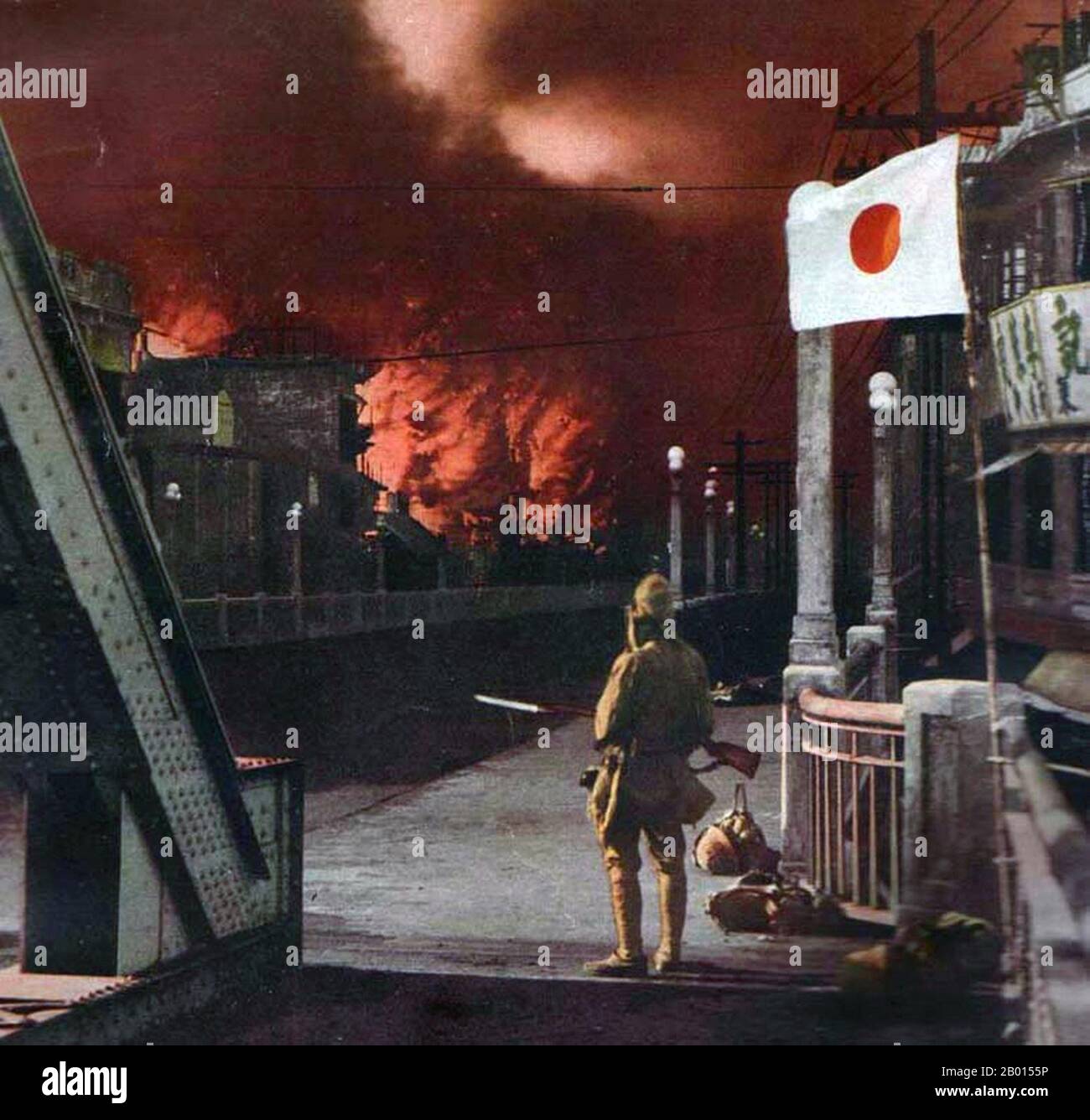 China: Shanghai suburbs ablaze as a Japanese soldier looks on. Second Sino-Japanese War (July 7, 1937 – September 9, 1945).  The Second Sino-Japanese War was a military conflict fought primarily between the Republic of China and the Empire of Japan. After the Japanese attack on Pearl Harbor, the war merged into the greater conflict of World War II as a major front of what is broadly known as the Pacific War. Although the two countries had fought intermittently since 1931, total war started in earnest in 1937 and ended only with the surrender of Japan in 1945. Stock Photo