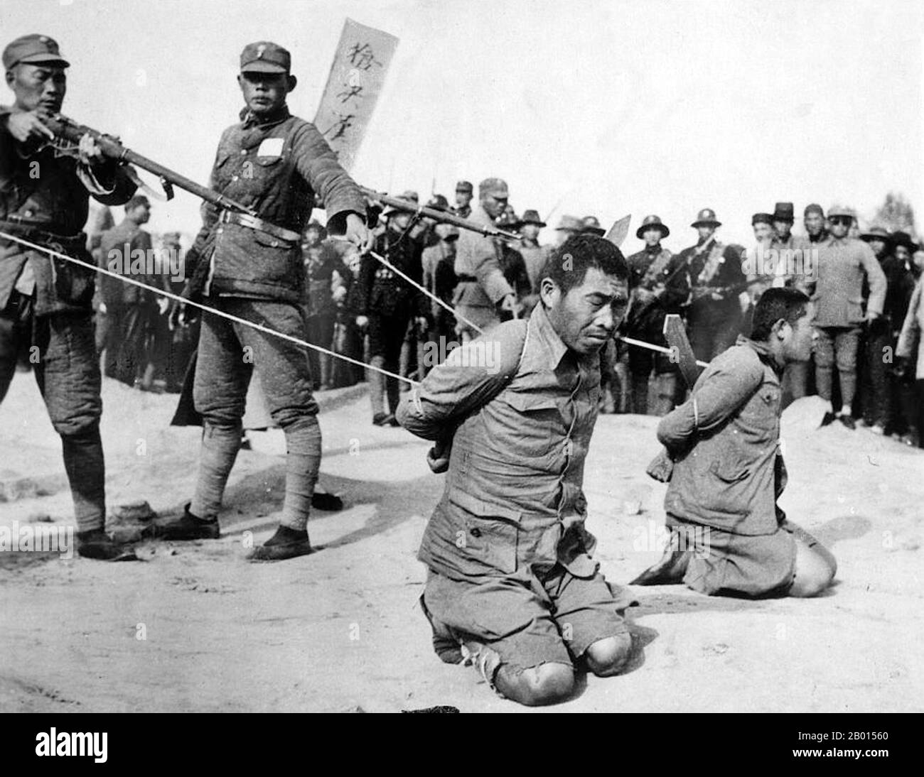 China: Execution of Chinese collaborators by Nationalist troops, Shanghai, 1937. Second Sino-Japanese War (July 7, 1937 – September 9, 1945).  The Second Sino-Japanese War was a military conflict fought primarily between the Republic of China and the Empire of Japan. After the Japanese attack on Pearl Harbor, the war merged into the greater conflict of World War II as a major front of what is broadly known as the Pacific War. Although the two countries had fought intermittently since 1931, total war started in earnest in 1937 and ended only with the surrender of Japan in 1945. Stock Photo
