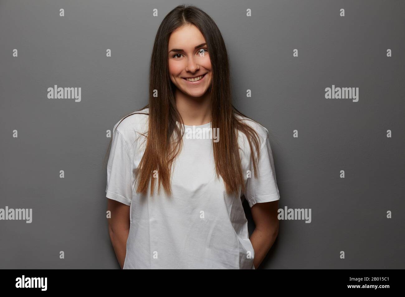 young girl posing in studio background Stock Photo - Alamy