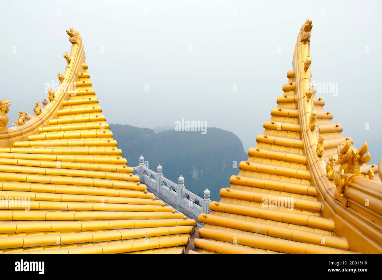 China: Mist engulfs the mountain at the Golden Summit (Jin Ding), Emeishan (Mount Emei), Sichuan Province.  At 3,099 metres (10,167 ft), Mt. Emei is the highest of the Four Sacred Buddhist Mountains of China. The patron bodhisattva of Emei is Samantabhadra, known in Chinese as Puxian. 16th and 17th century sources allude to the practice of martial arts in the monasteries of Mount Emei. Stock Photo