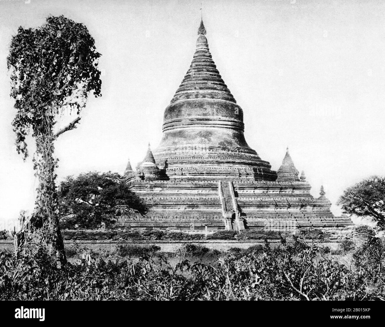 Burma/Myanmar: Mingalazedi Pagoda in Bagan, Upper Burma, c. 1920s.  Mingalazedi Pagoda was built in 1284 during the reign of King Narathihapate. It is one of the few temples in Bagan with a full set of glazed terracotta tiles depicting the ‘Jataka’—an ancient Pali book of verses related to the previous births of the Buddha.  The pagoda was built in brick and contains several terraces leading to a large pot-shaped stupa at its centre, topped by a bejeweled umbrella (hti). Mingalazedi Pagoda was built a few years before the First Burmese Empire (Pagan Kingdom) was pillaged by the Mongols in 1287 Stock Photo
